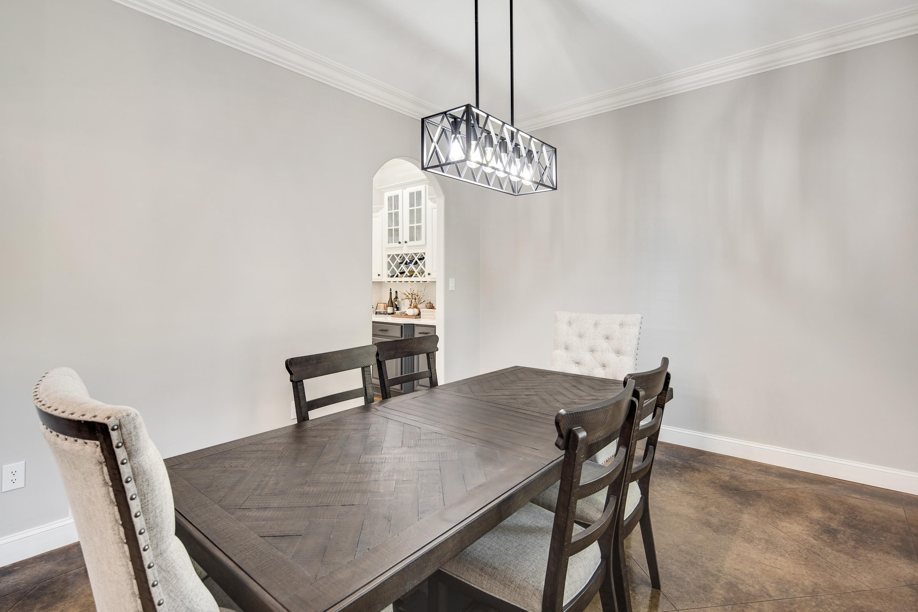 Dining area featuring crown molding