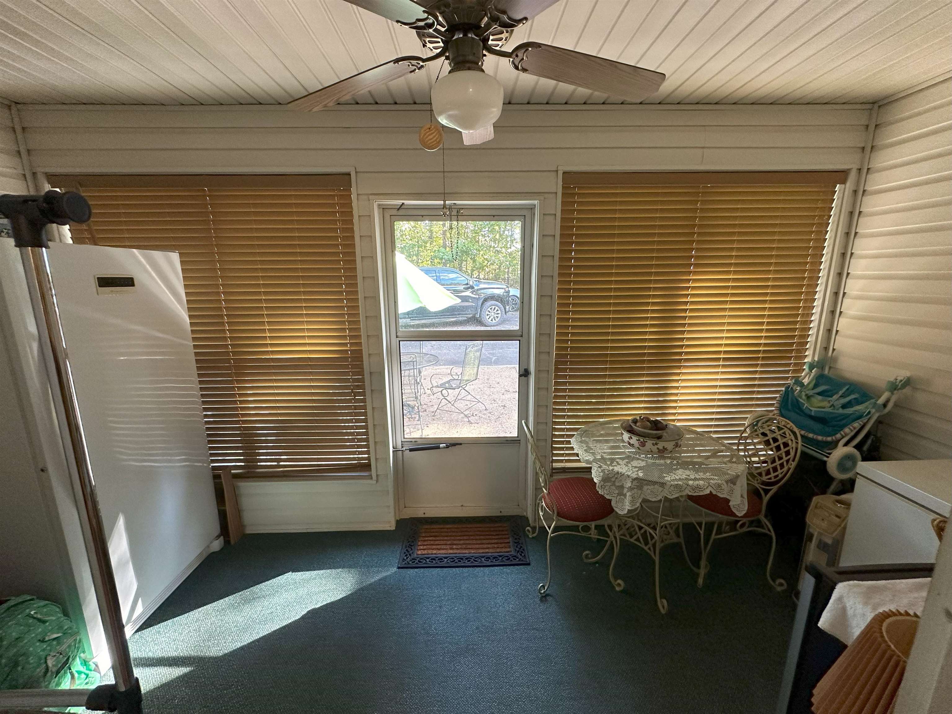 Interior space with wooden ceiling and ceiling fan