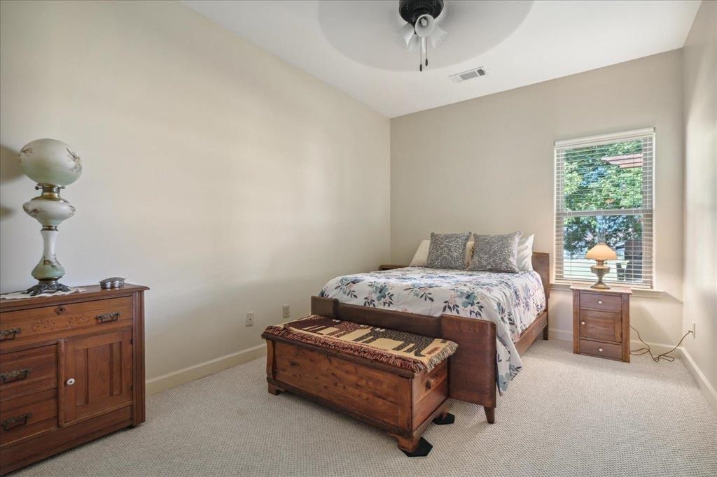Second bedroom with carpet.