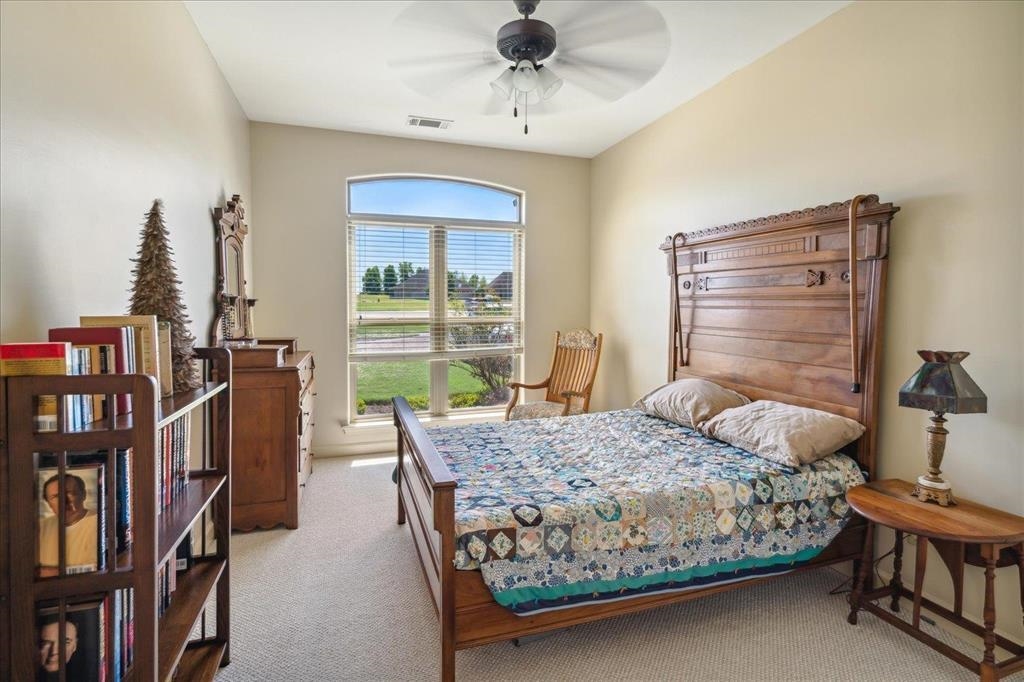 Bedroom 3 with carpet and plenty of natural light.