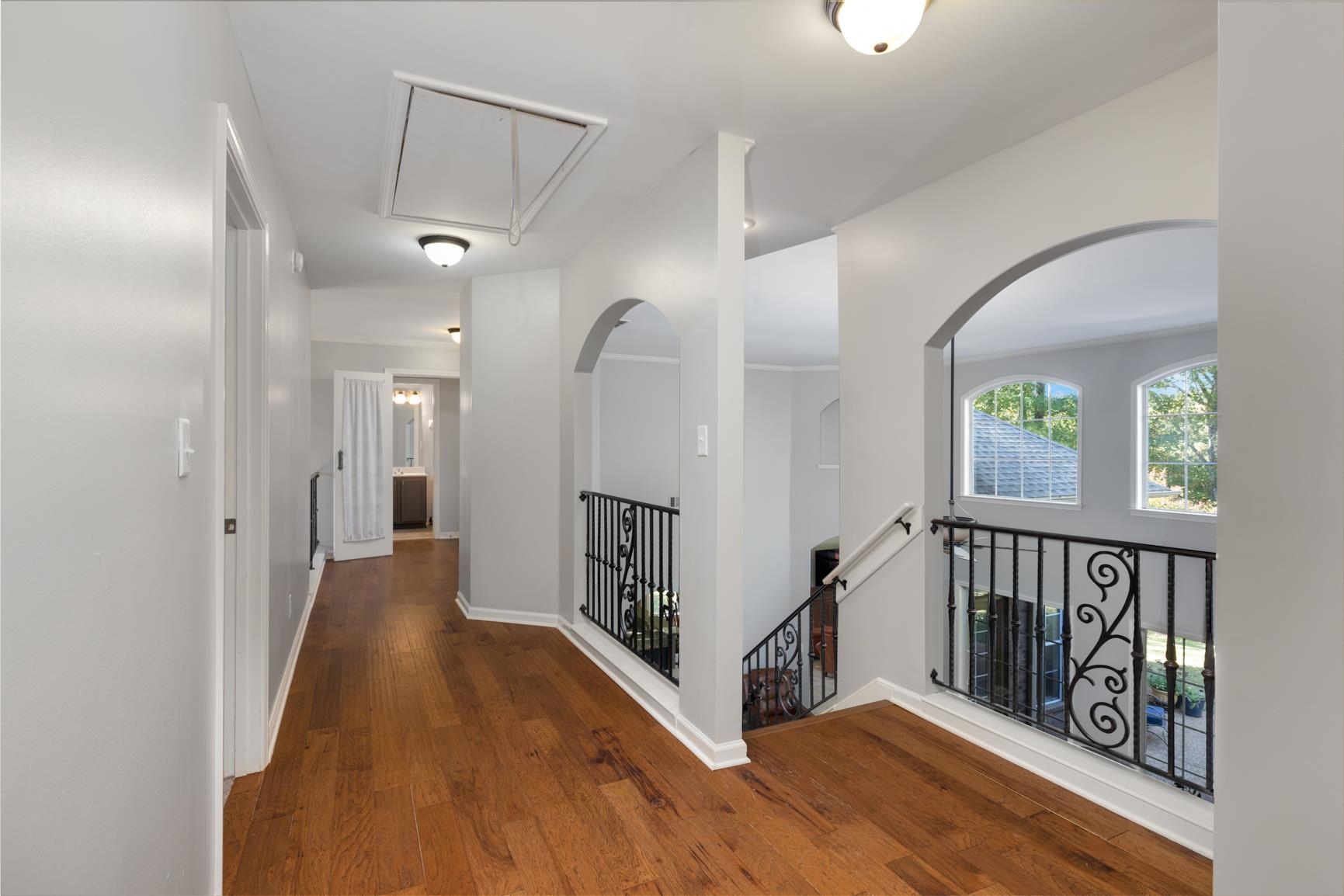 Hallway with dark wood-type flooring