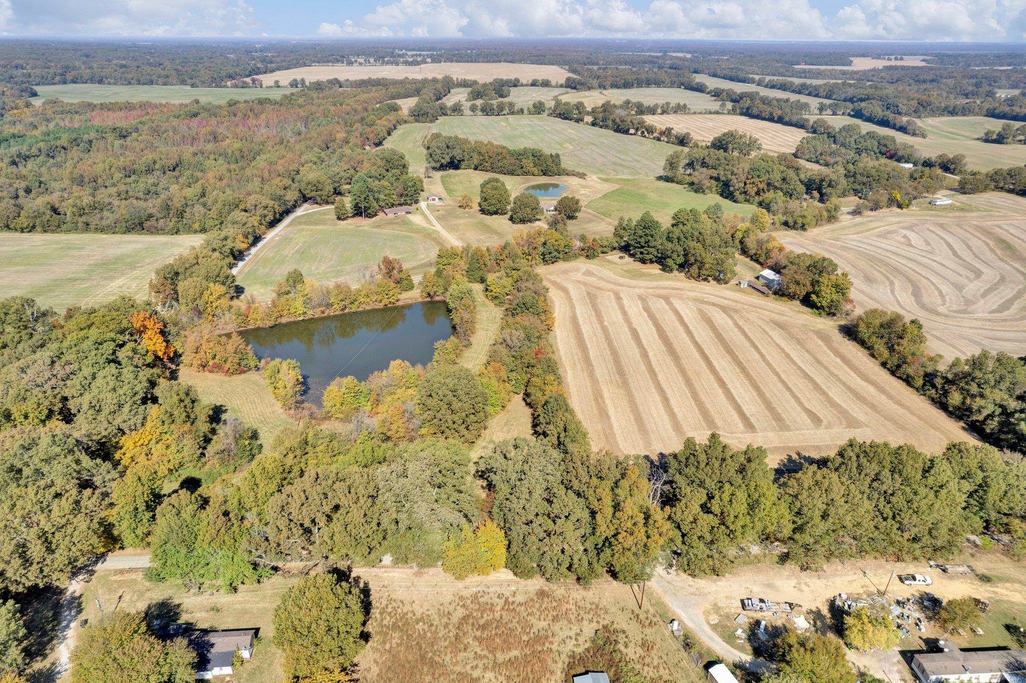 Bird\'s eye view featuring a water view and a rural view