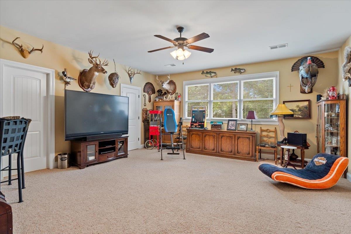 Carpeted office with ceiling fan