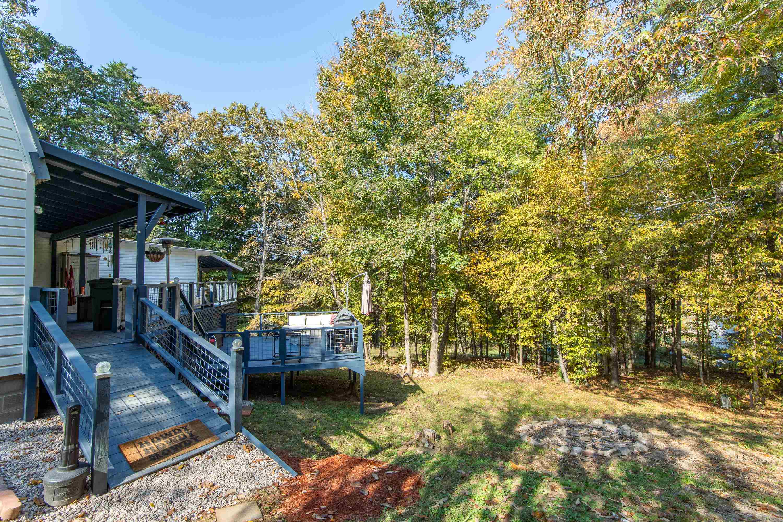 View of yard with a wooden deck