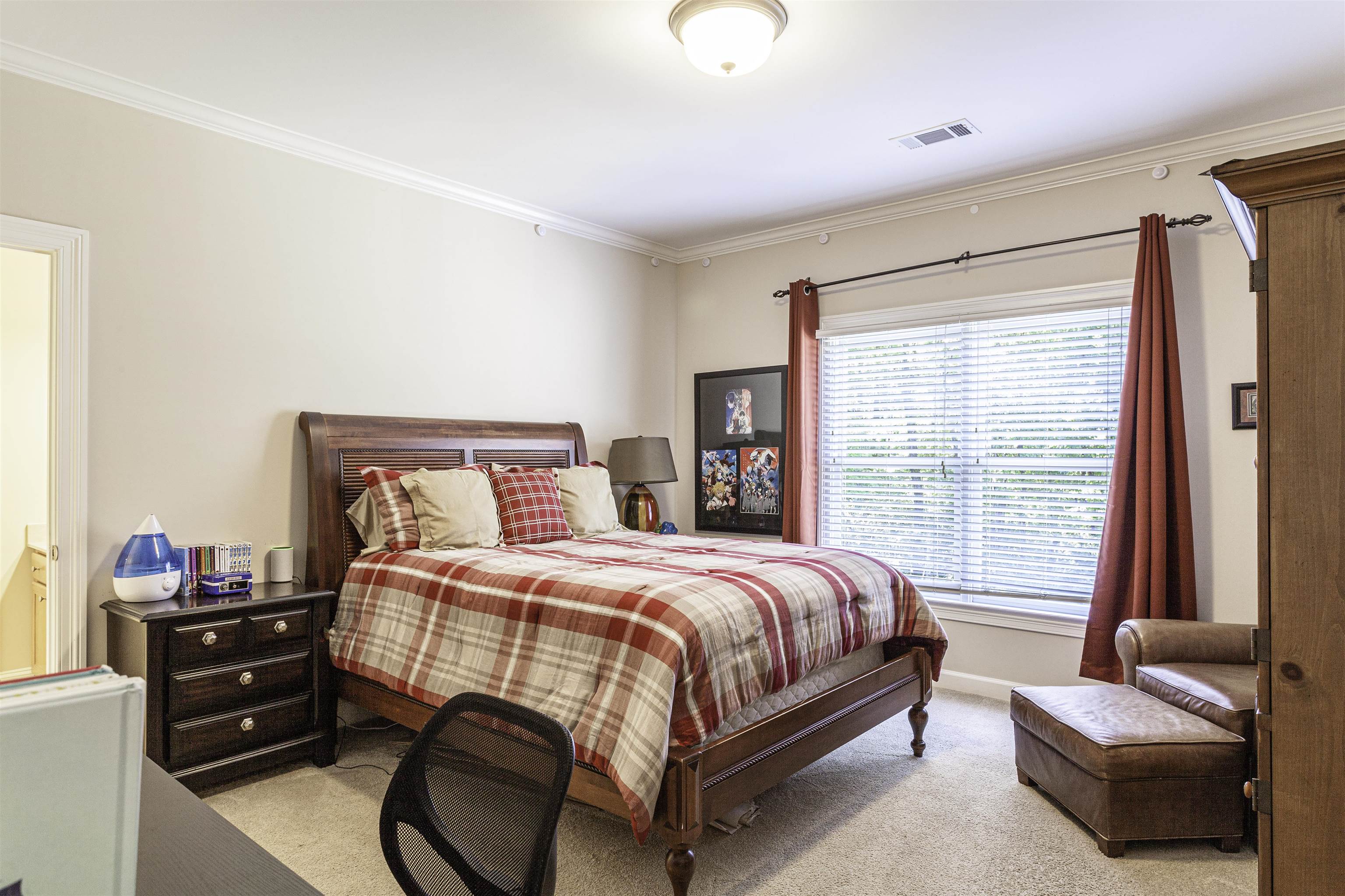 Bedroom 4, measuring 16x12, offers cozy carpeted floors, a distinctive walk-in turret closet, and direct access to the Jack-and-Jill bath.