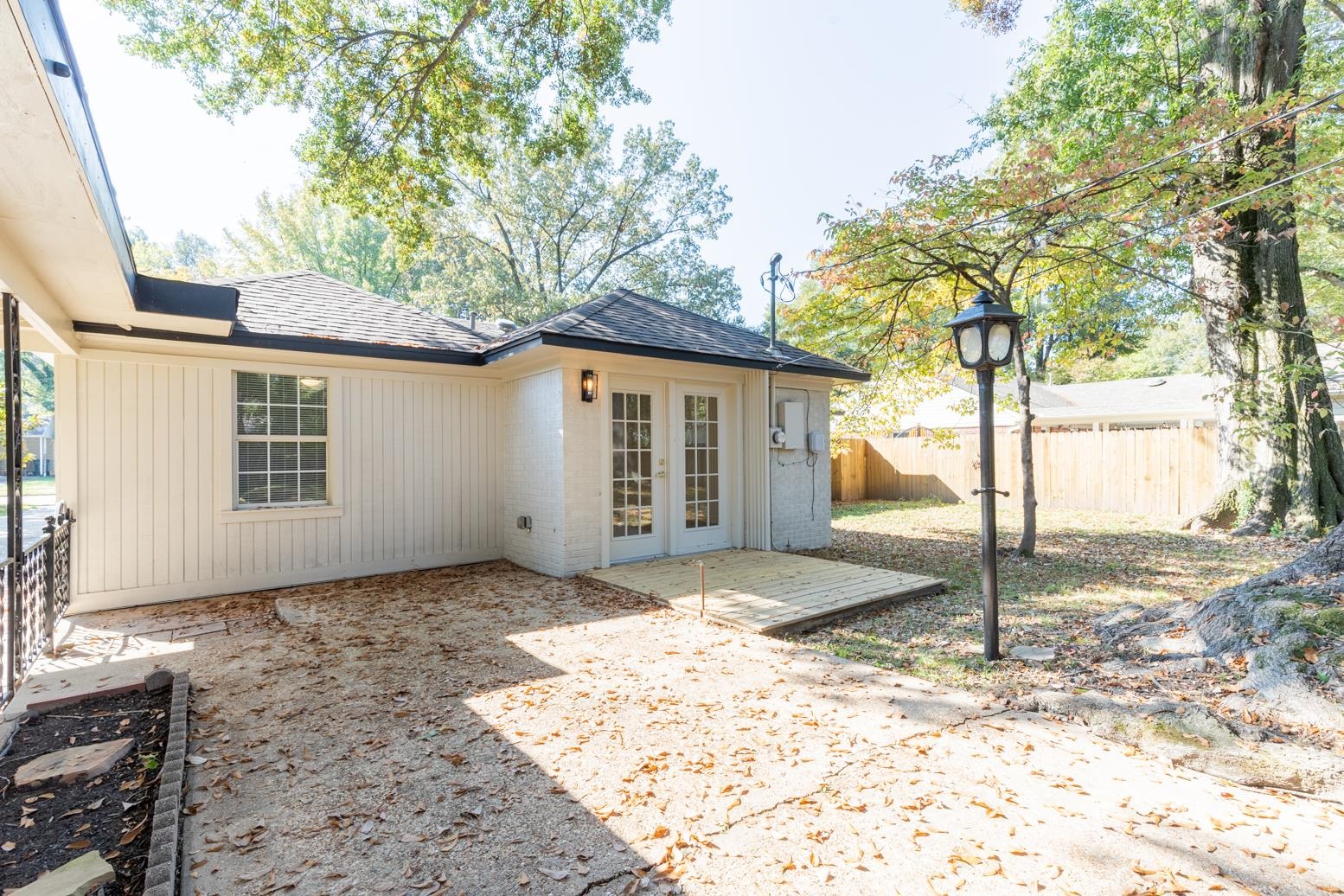 Back of property with a patio and french doors