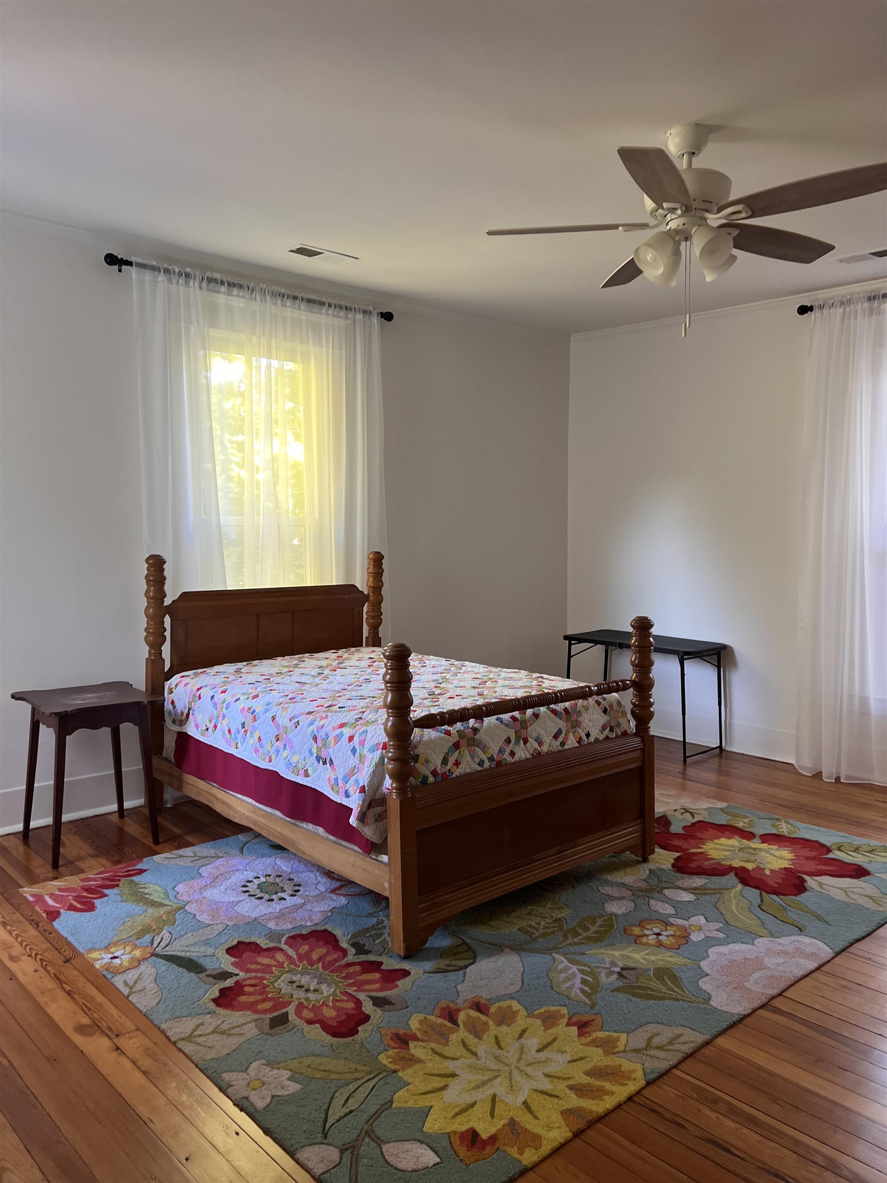 Bedroom with wood-type flooring and ceiling fan