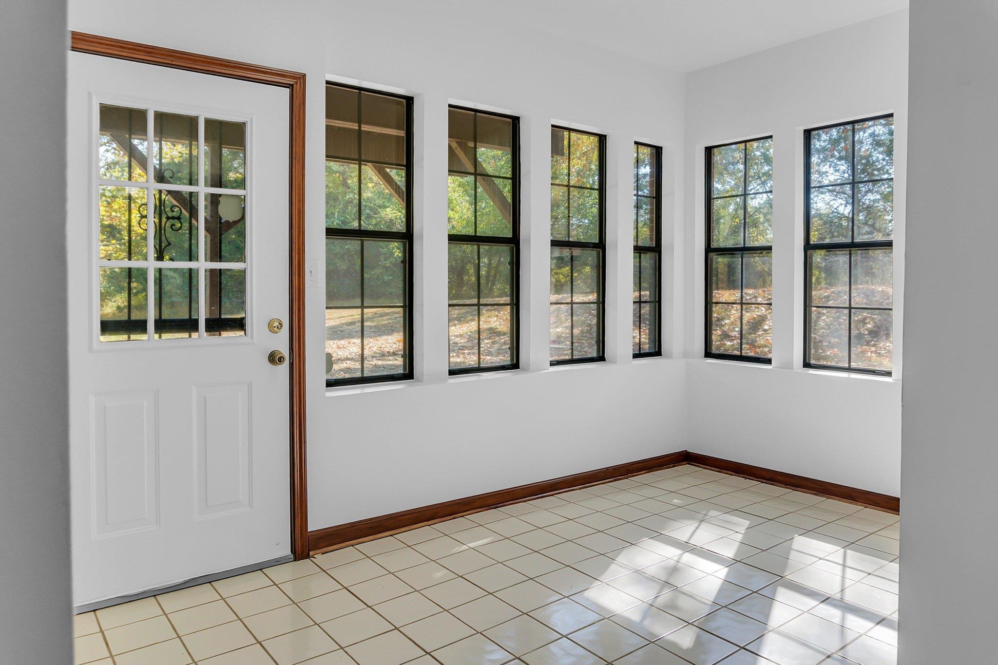 2nd sunroom featuring a healthy amount of sunlight