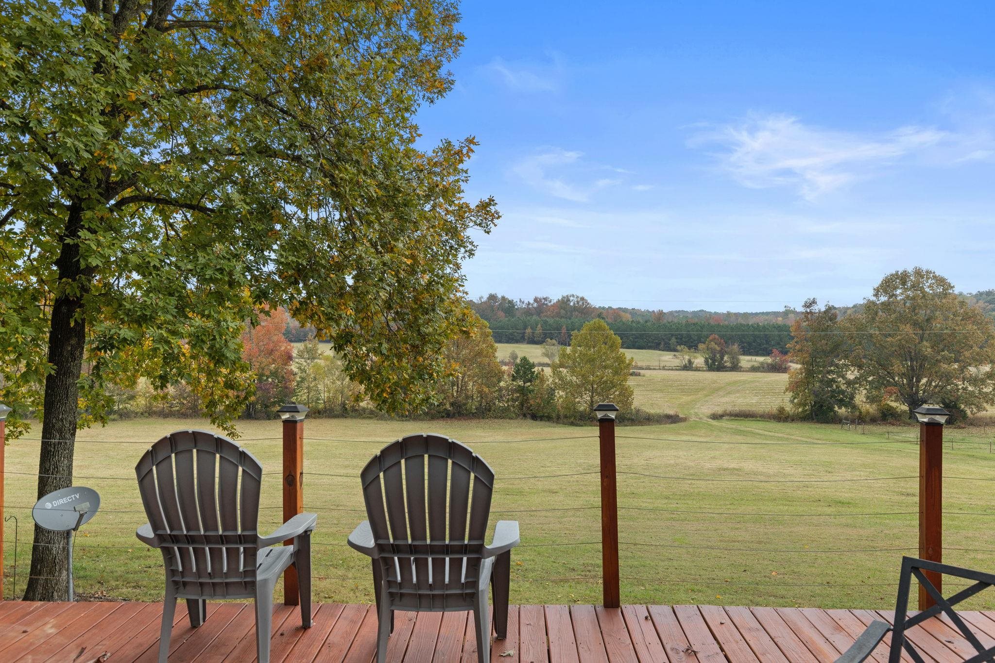 Wooden terrace with a lawn