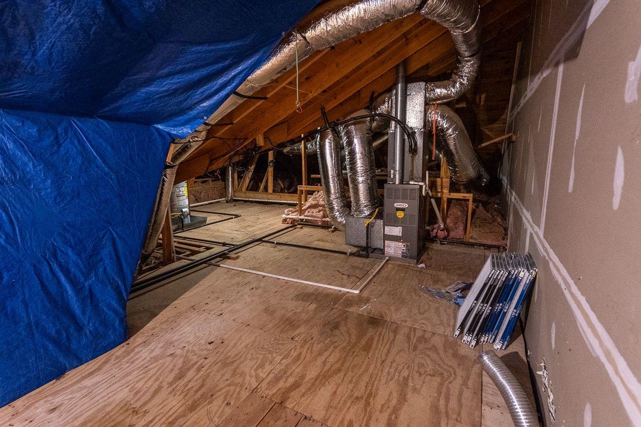 Spacious Attic that is floored and houses mechanicals for the home.