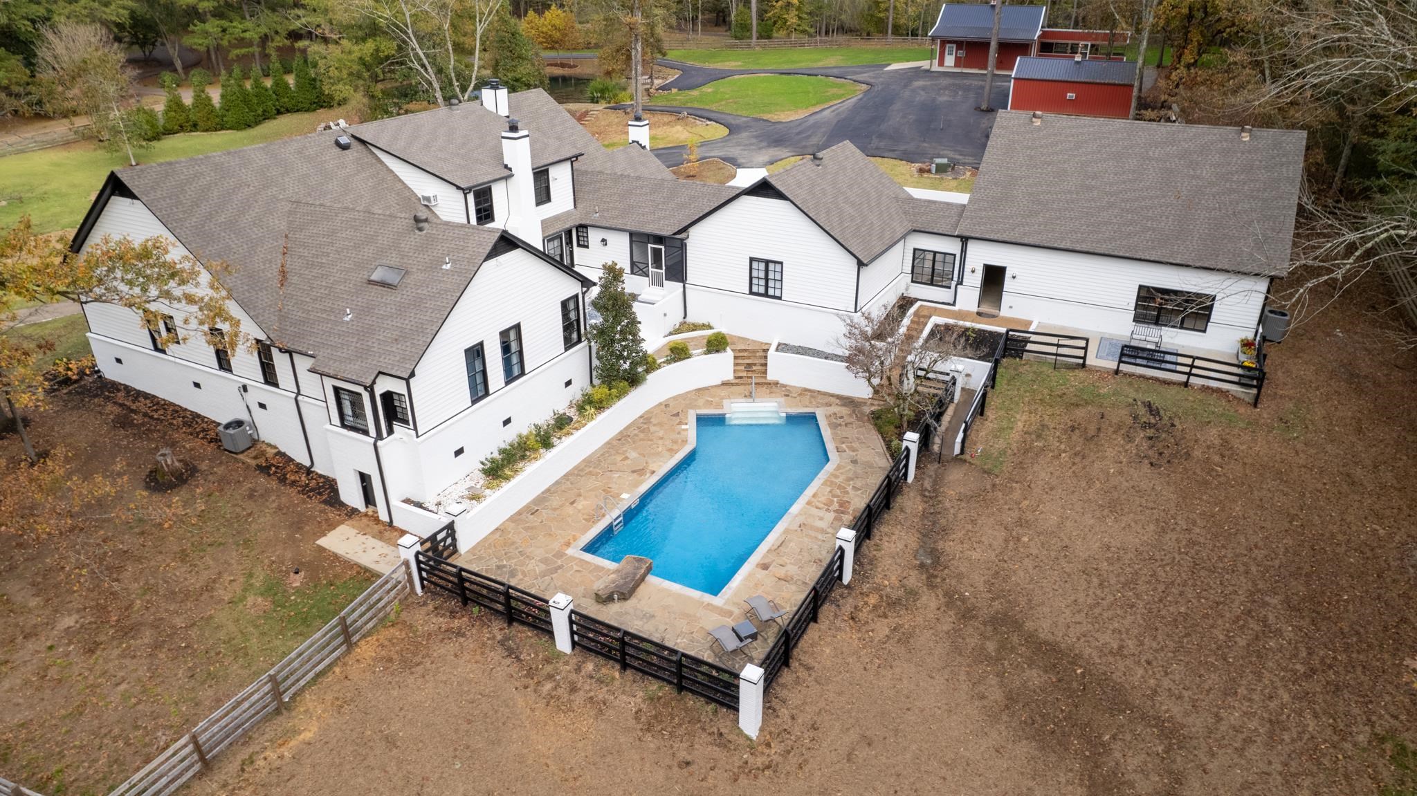 Back of the house with pool and two porch areas for entertaining.