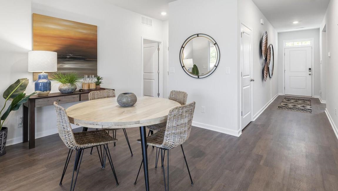 Dining room featuring dark wood-type flooring