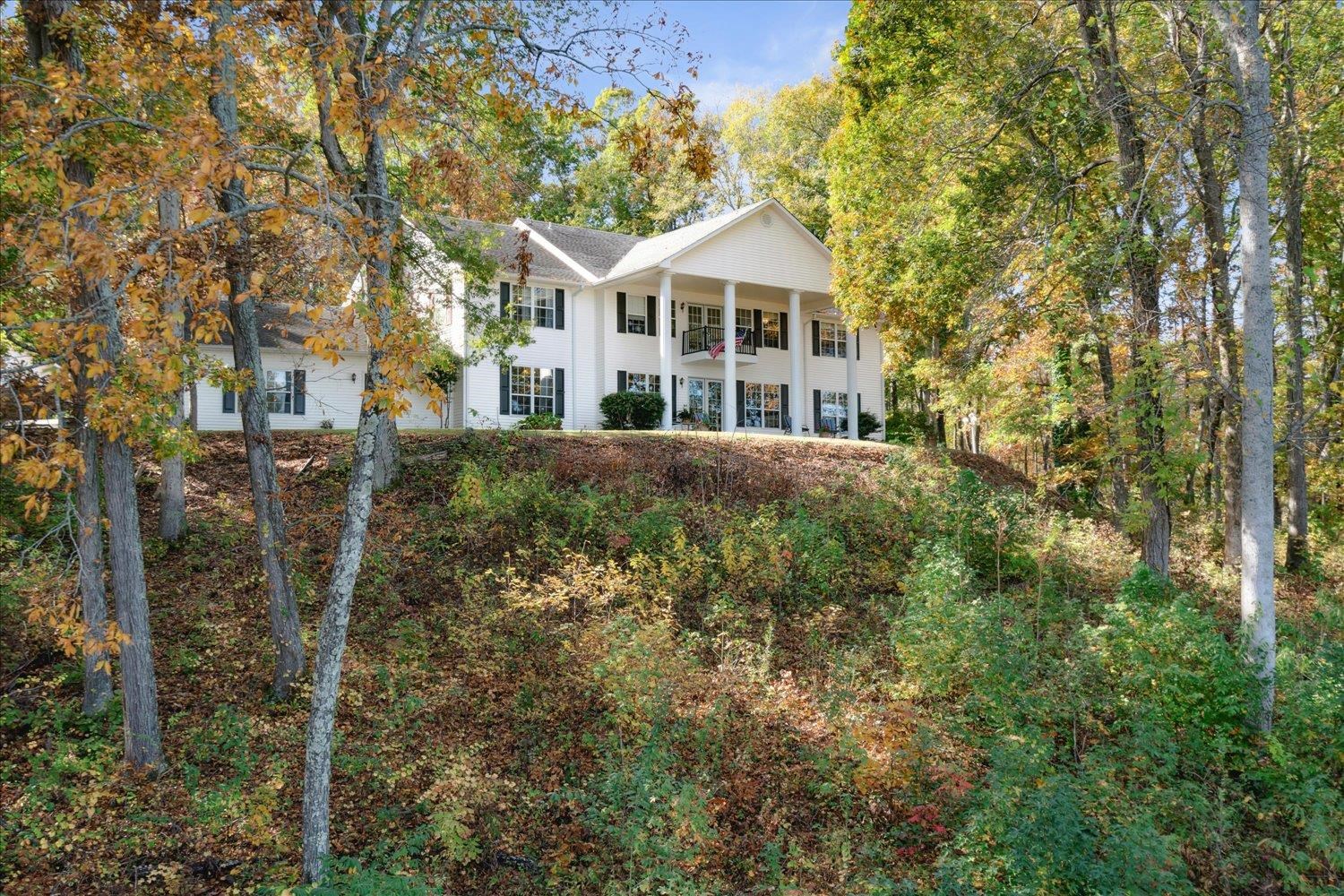 Neoclassical / greek revival house with a balcony