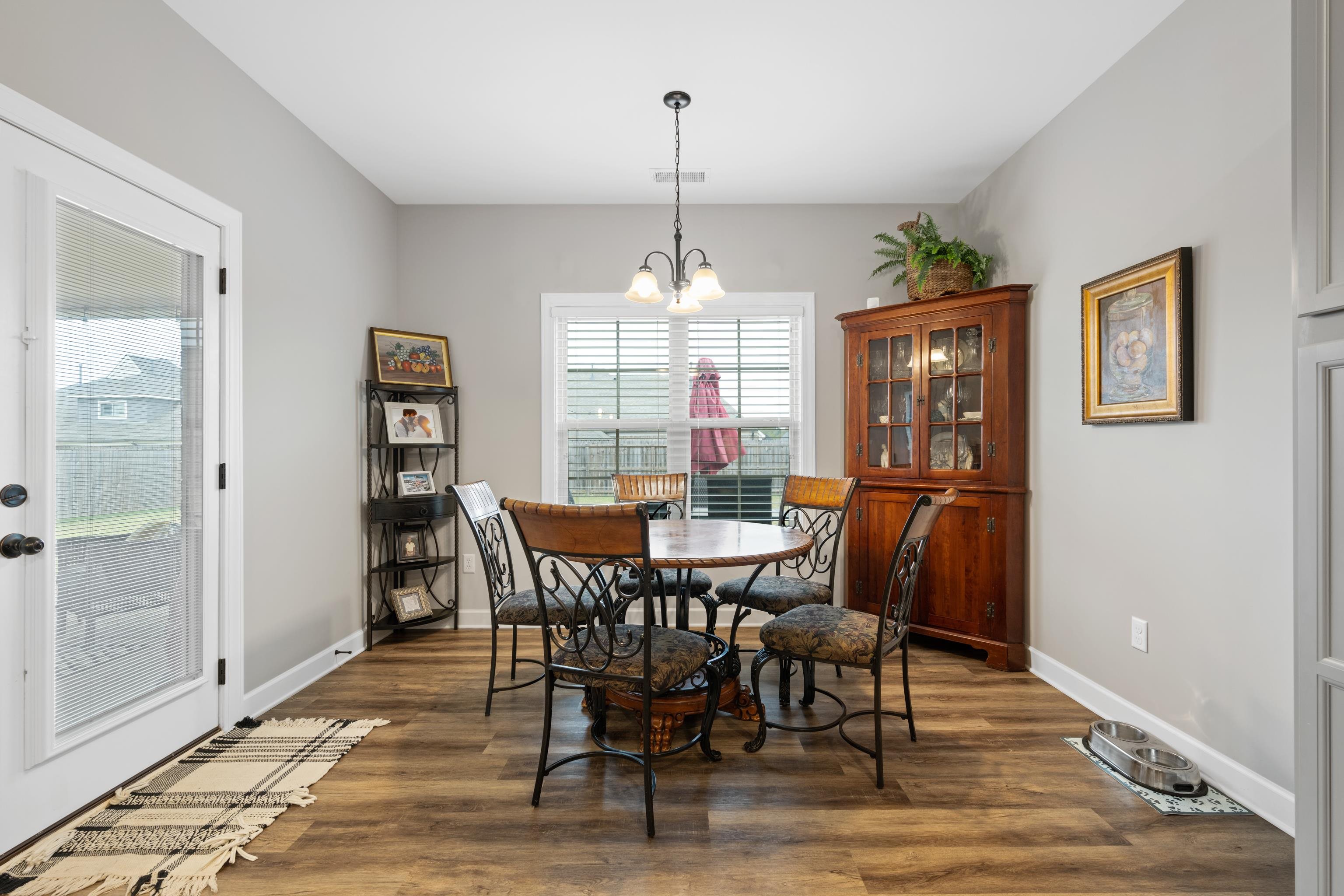 Dining room featuring dark hardwood / wood-style floors and an inviting chandelier