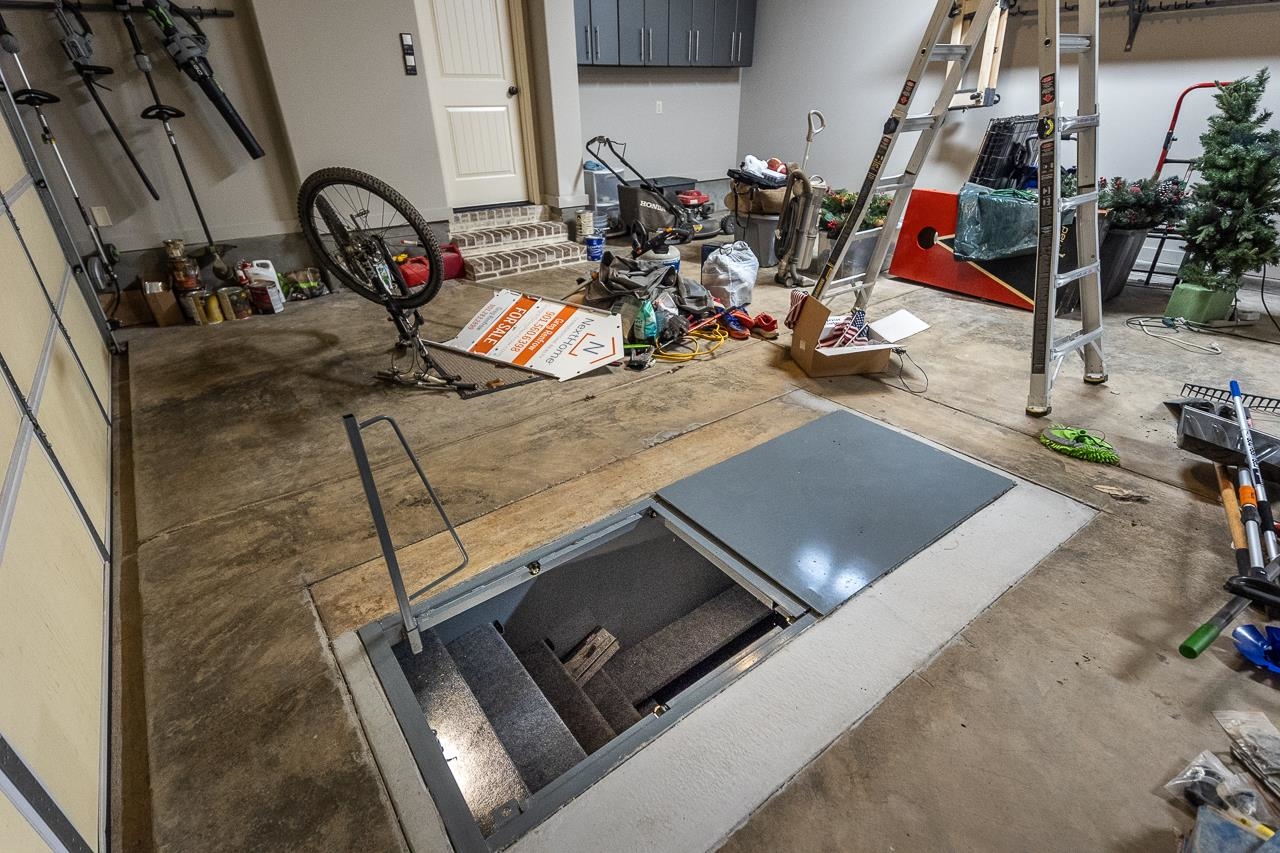 Storm shelter installed in the garage floor for your safety.