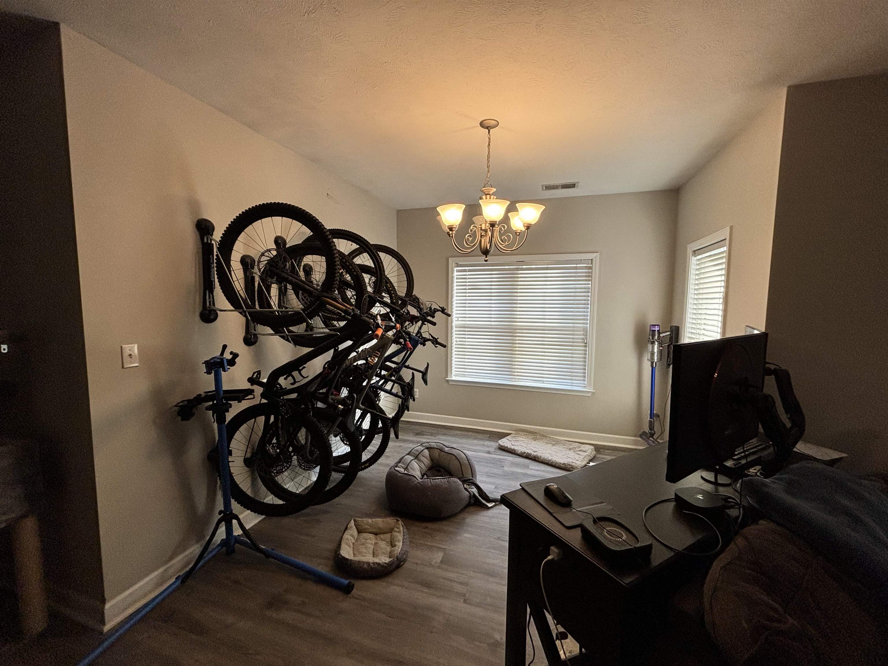 Interior space featuring dark wood-type flooring and a chandelier