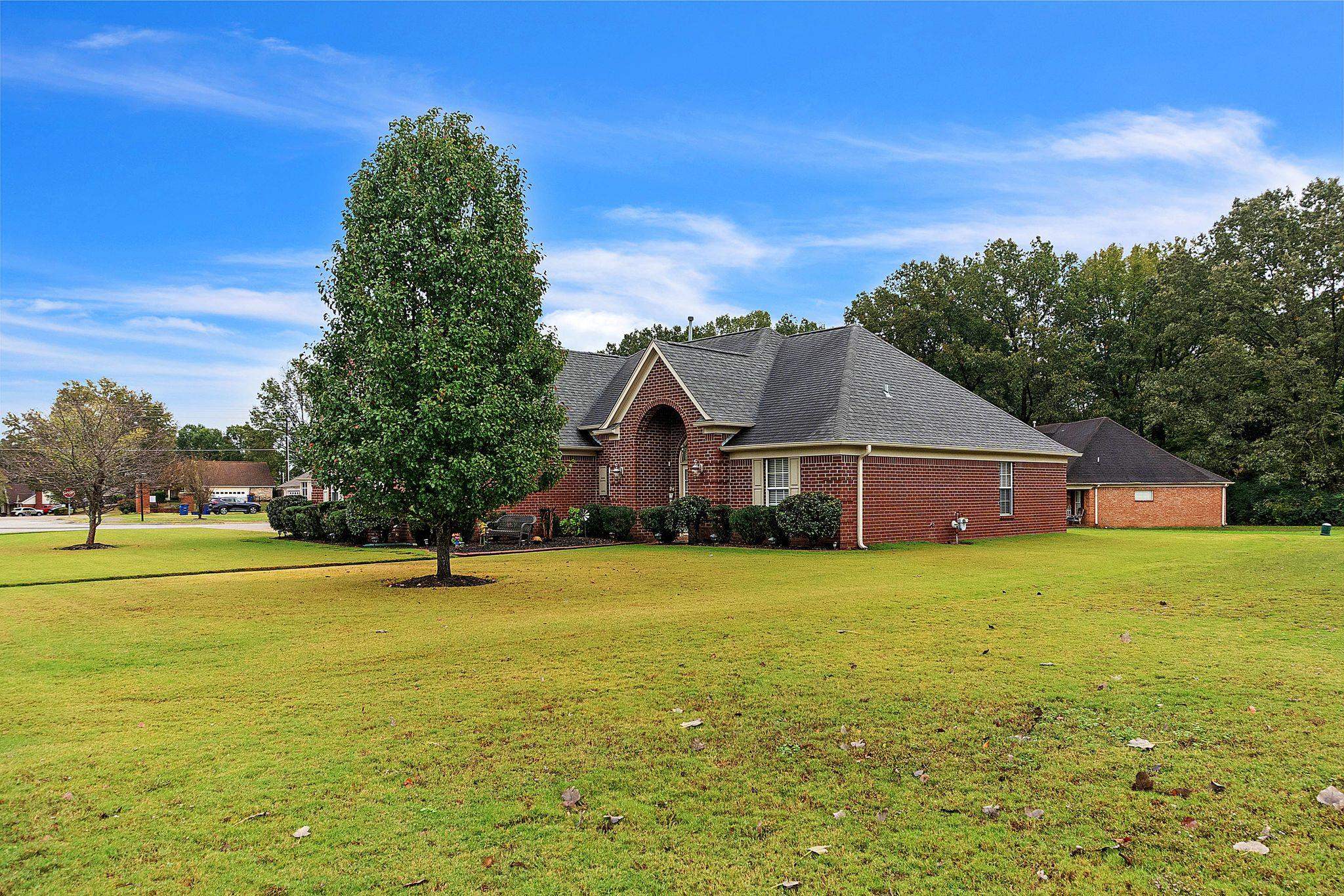 View of property exterior featuring a yard