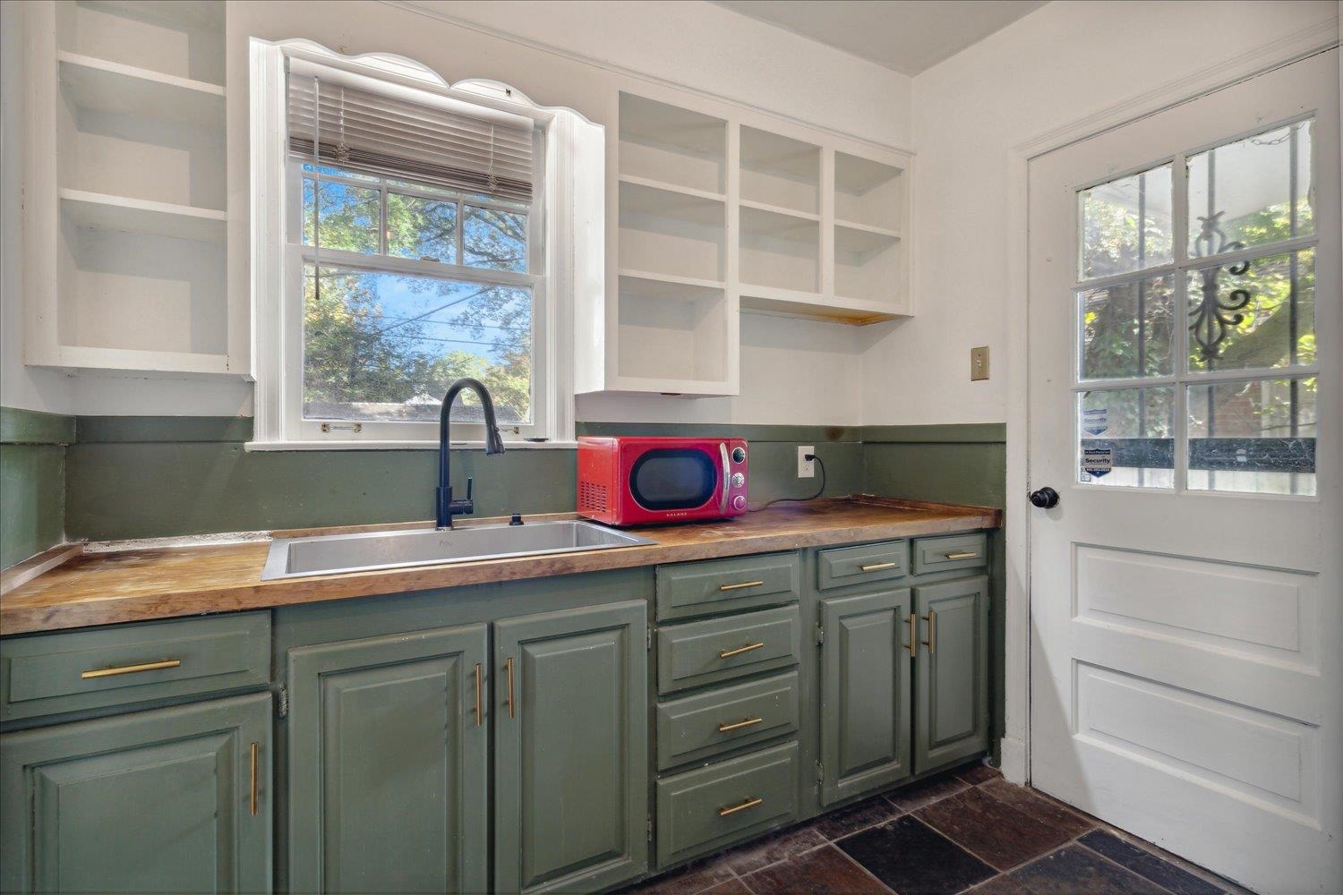 Kitchen featuring sink and butcher block countertops