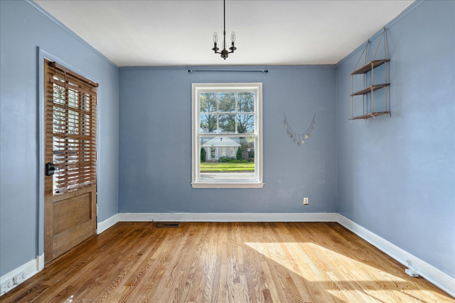 Unfurnished dining area with a wealth of natural light, light wood-type flooring, and ornamental molding