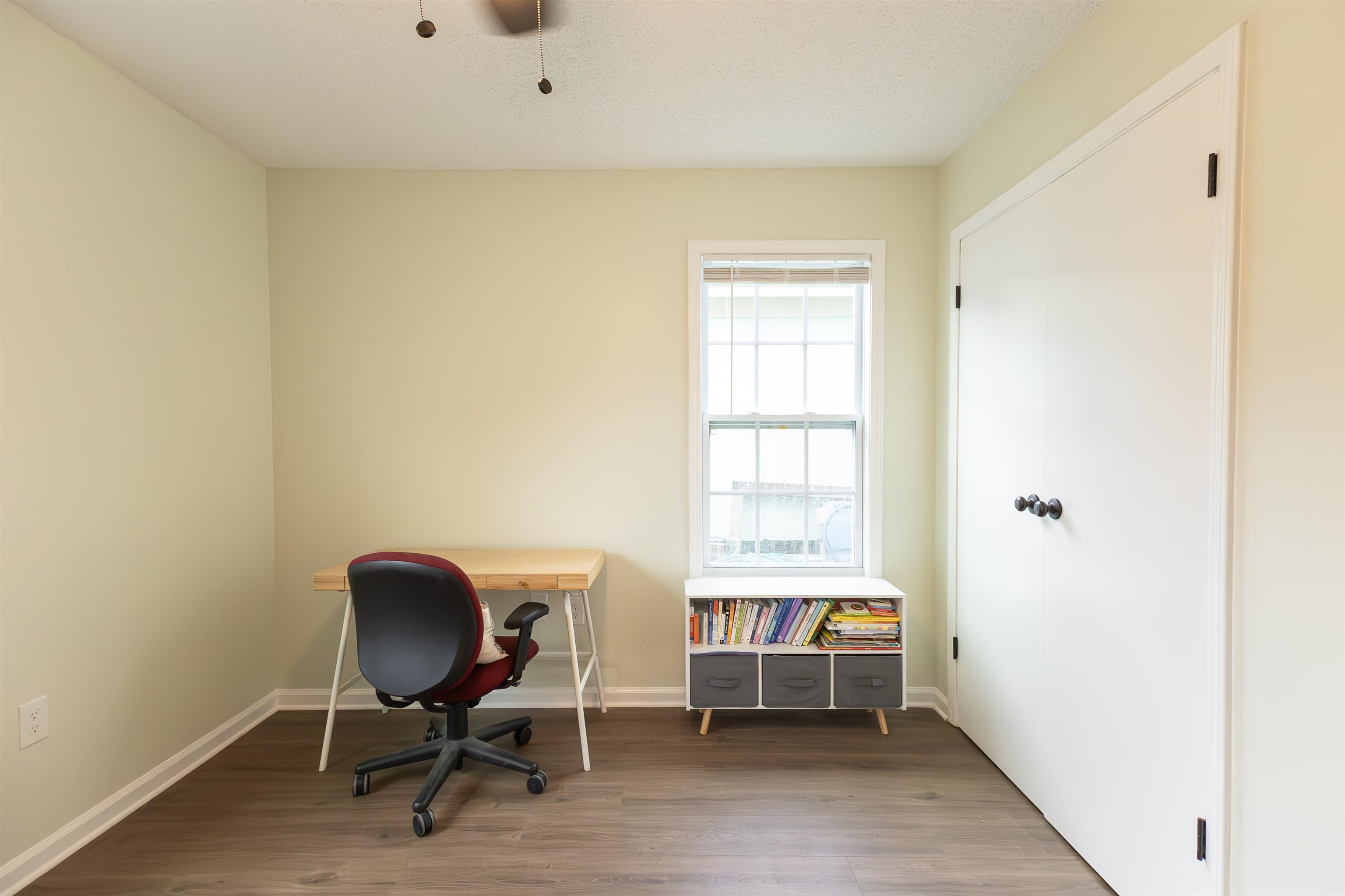 Home office featuring dark hardwood / wood-style floors