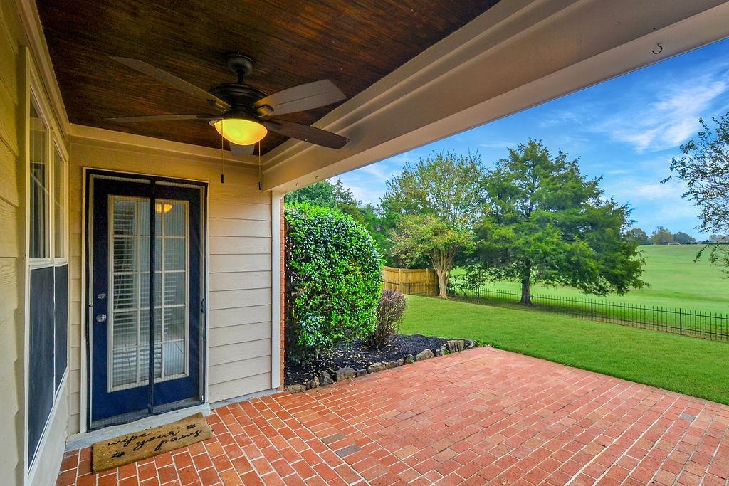 View of patio with ceiling fan