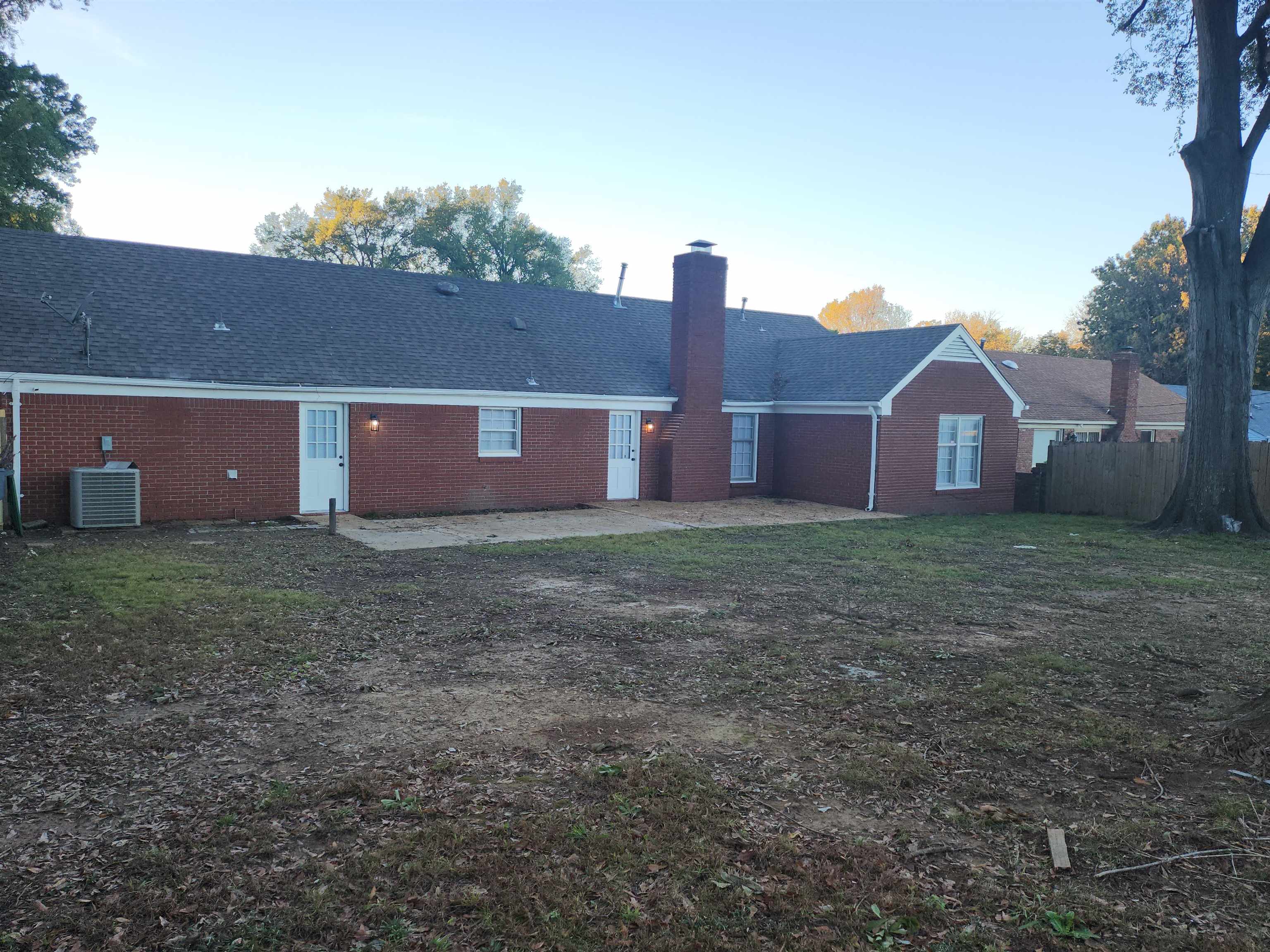 Back of property featuring central AC unit