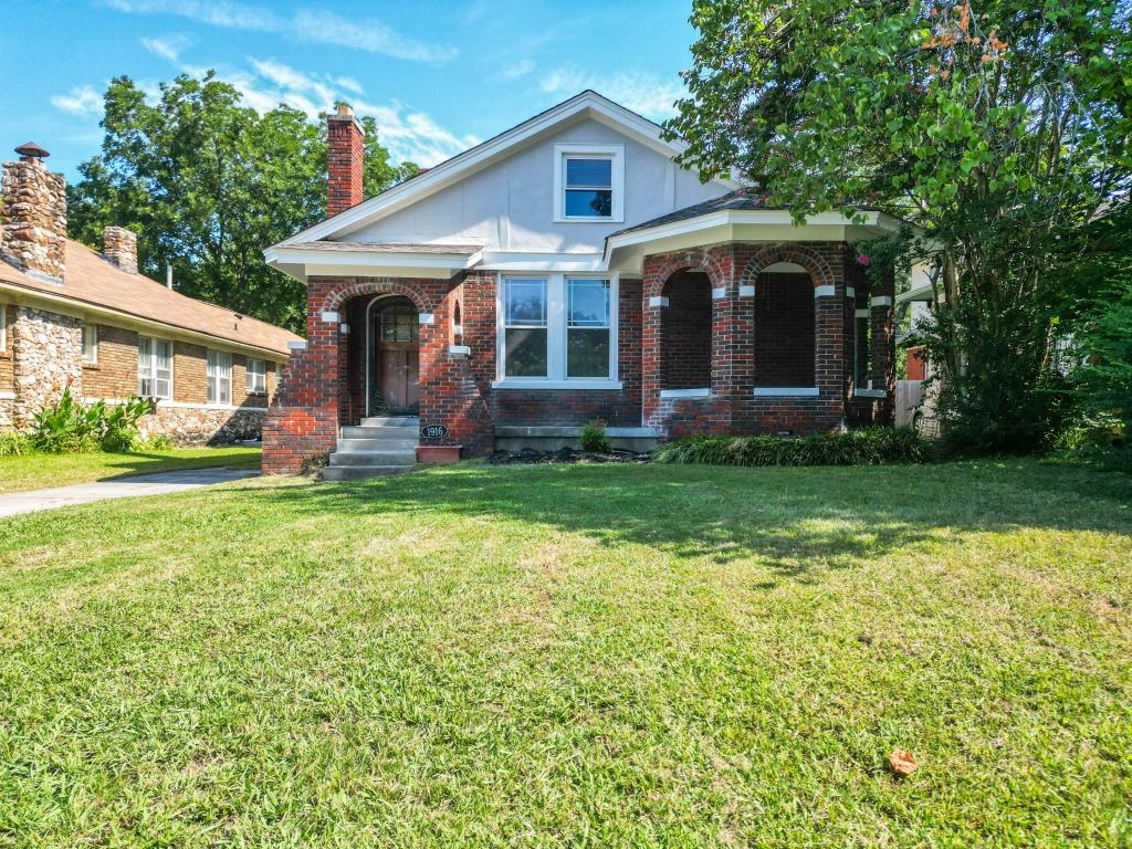 View of front of property with a front lawn