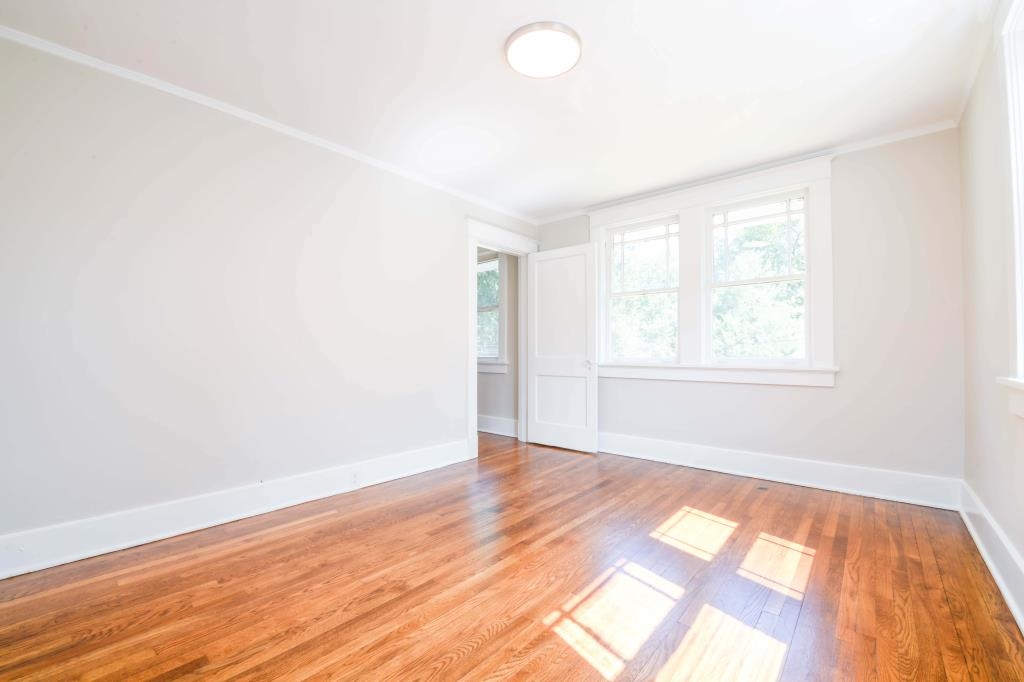 Unfurnished room featuring ornamental molding and light hardwood / wood-style floors