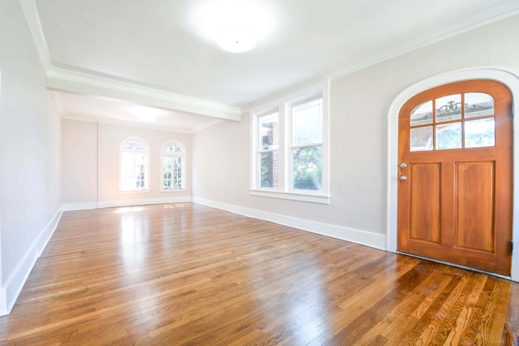 Entryway featuring ornamental molding and hardwood / wood-style flooring
