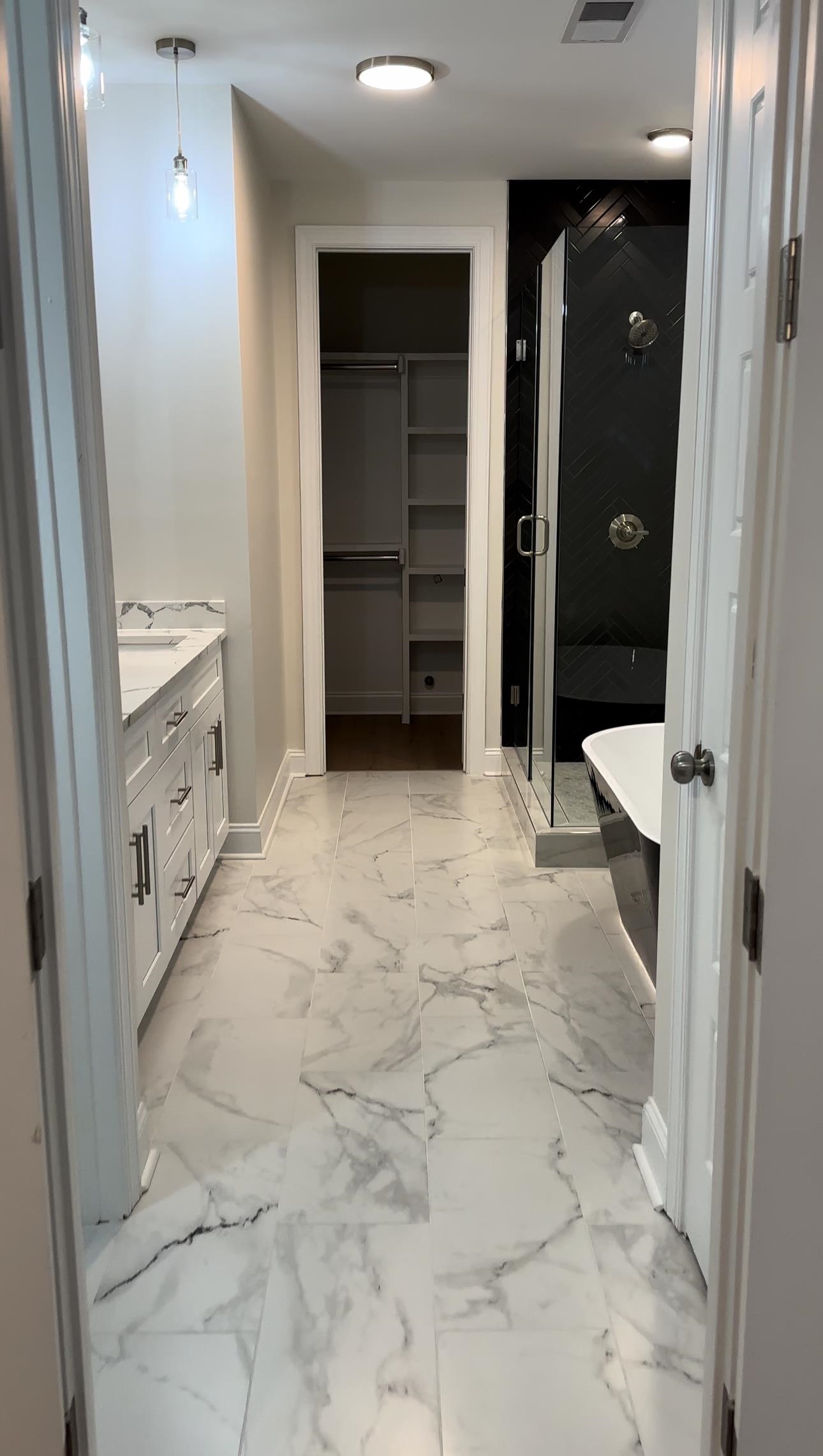 Bathroom with vanity and independent shower and bath