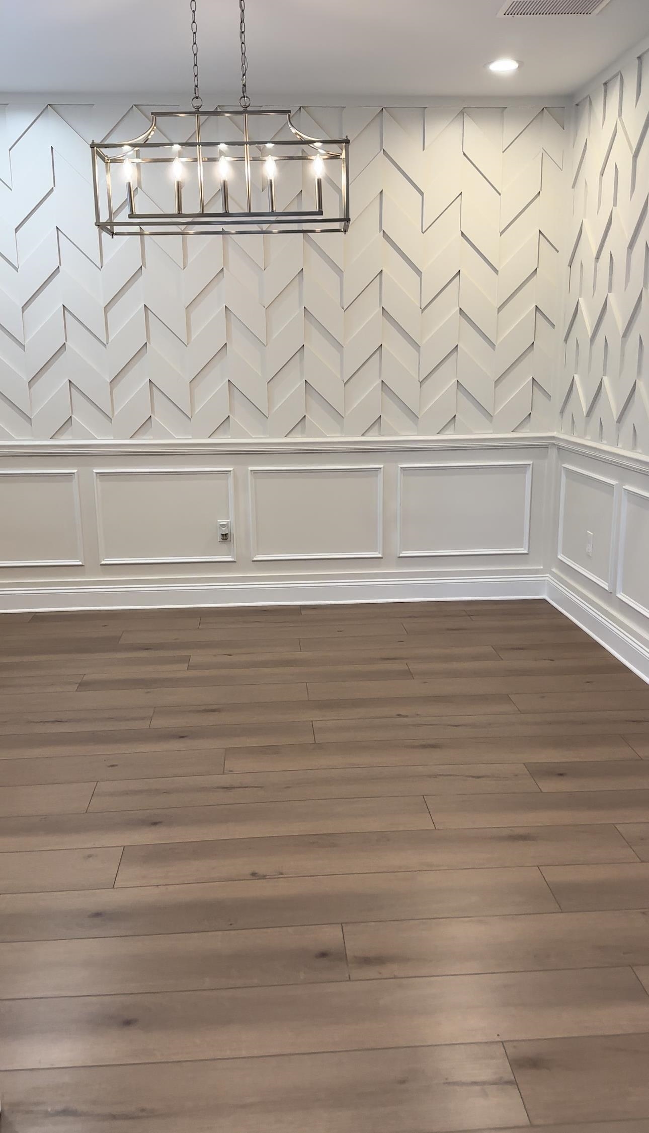 Unfurnished dining area featuring dark wood-type flooring