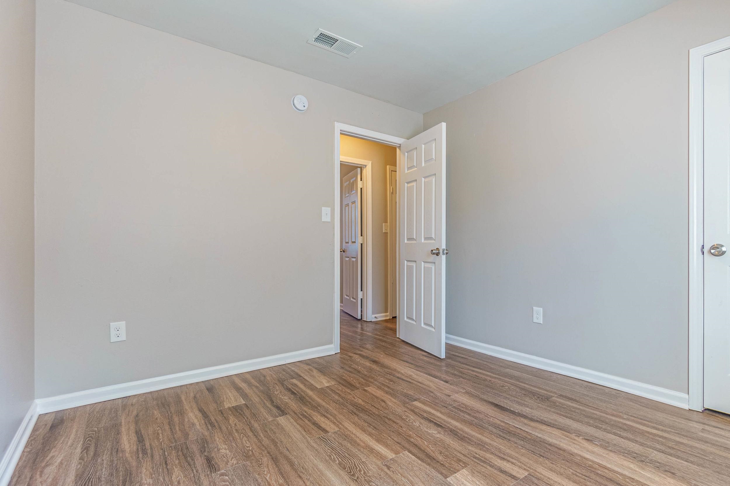 Spare room with wood-type flooring