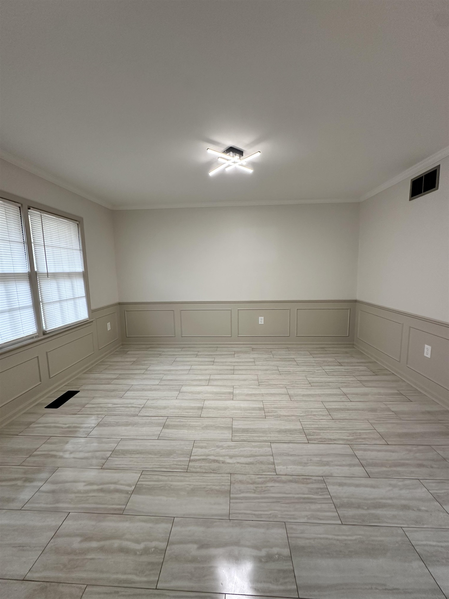 Spare room featuring ornamental molding