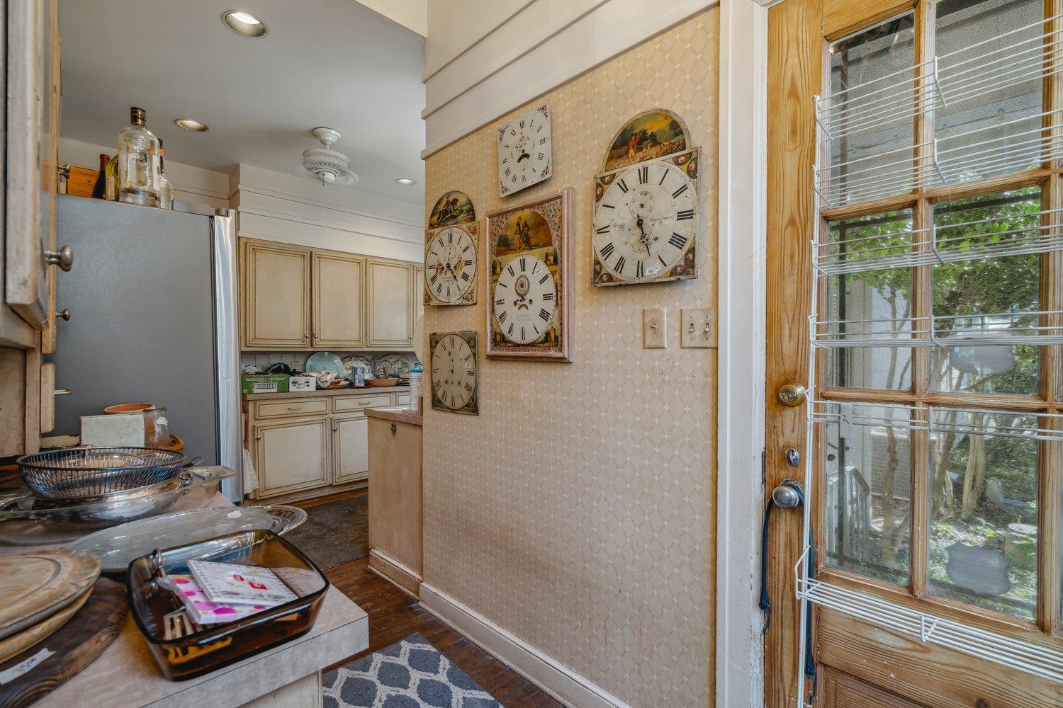 Kitchen with dark hardwood / wood-style floors and refrigerator