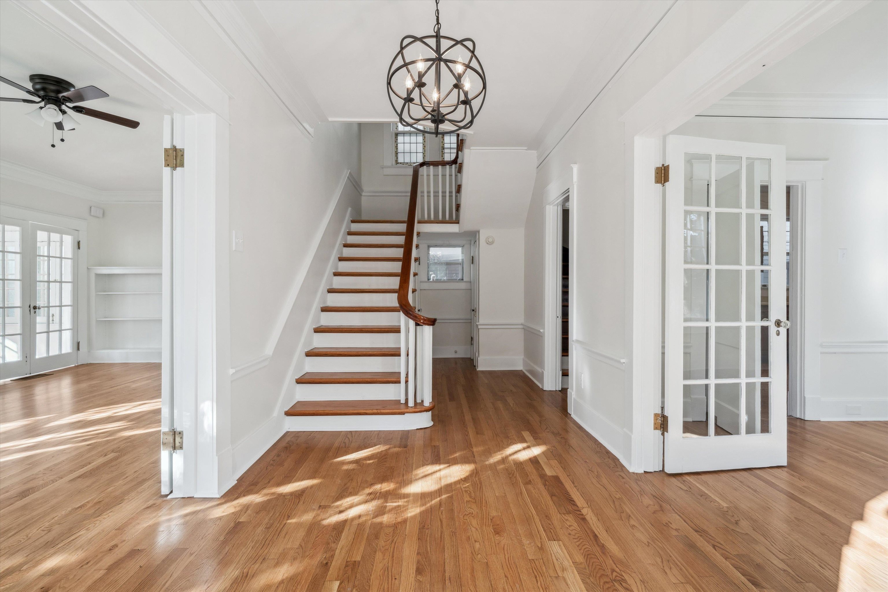 Gleaming Hardwood Floors / Curved stair railing, new light fixture, french doors to Dining and great room