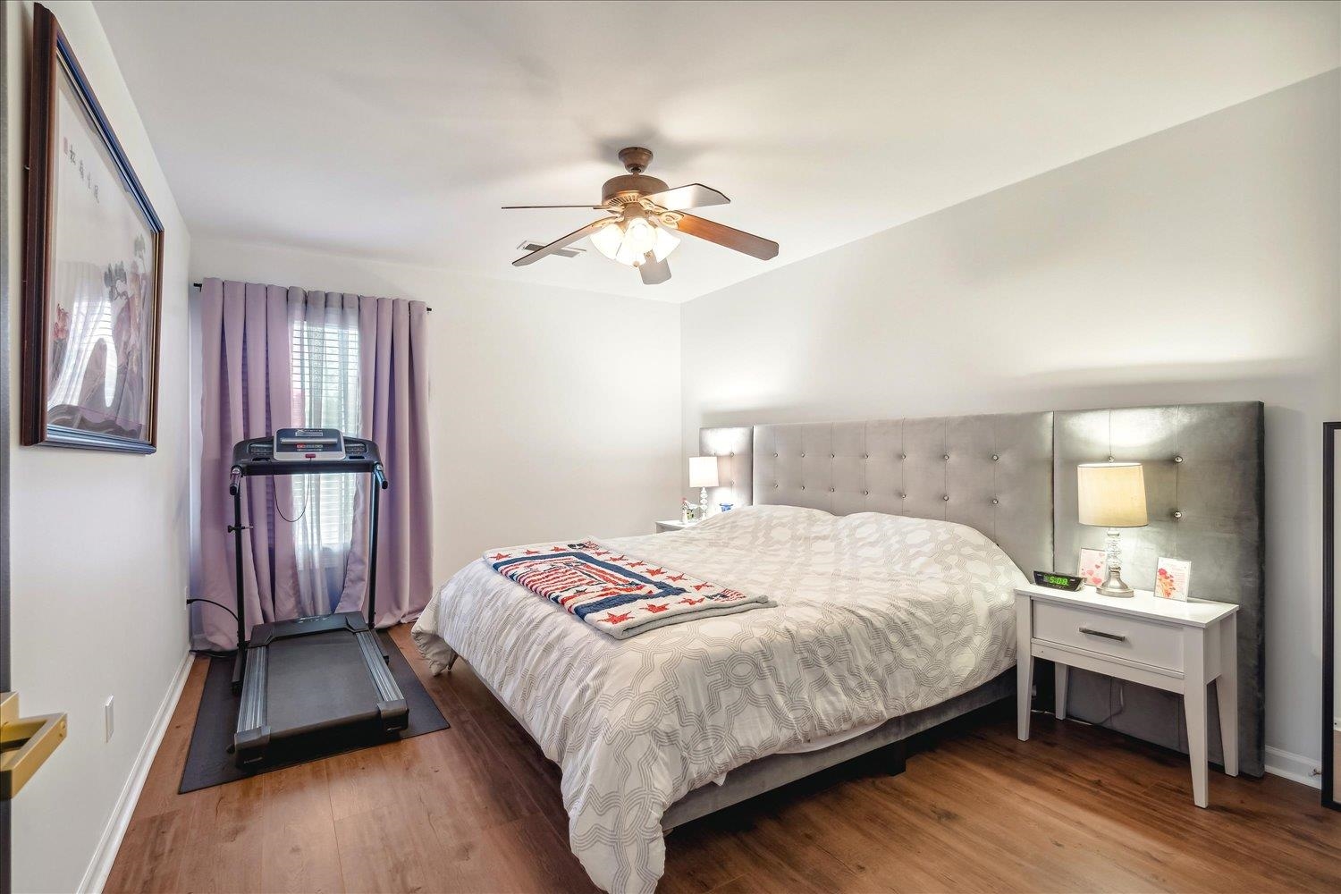 Bedroom with hardwood / wood-style flooring and ceiling fan