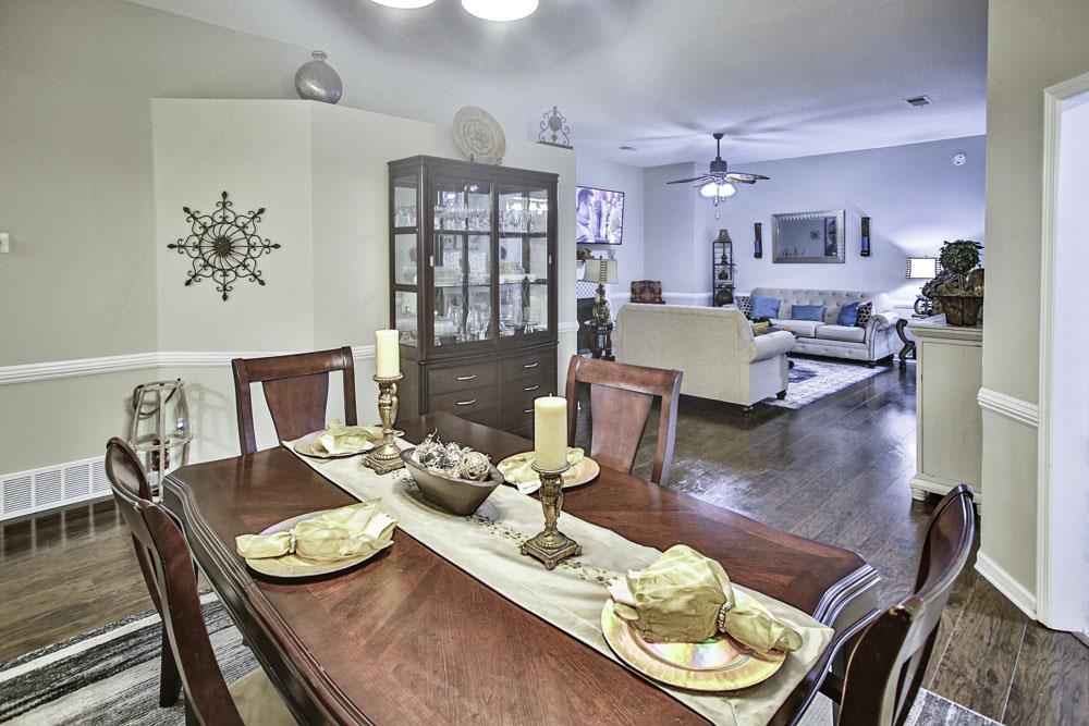 Dining room featuring dark hardwood / wood-style floors and ceiling fan