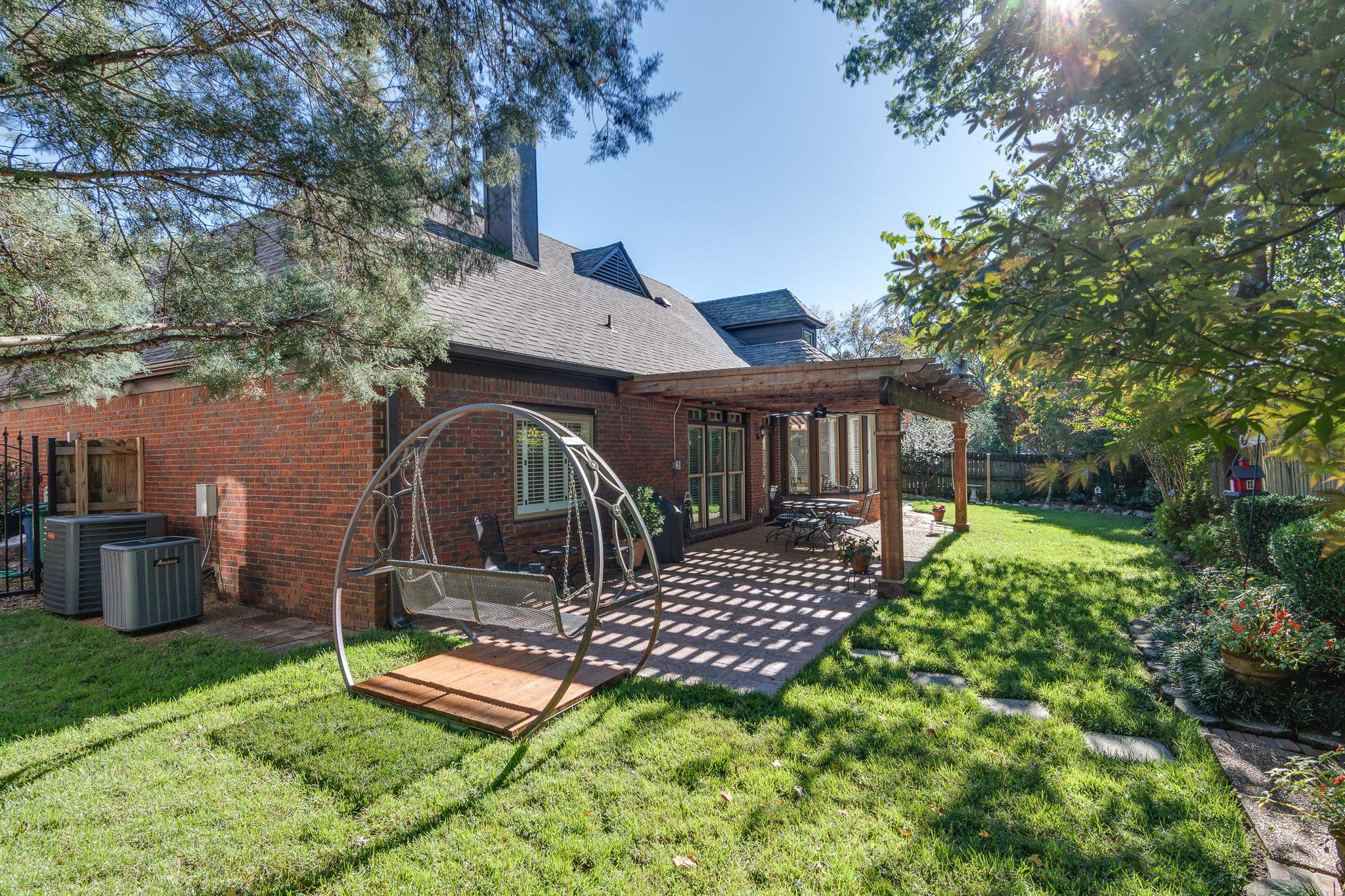 Beautiful back yard is immaculately taken care of. Seller  installed a 4 ft wide commercial grade steel gate on the north side and replaced the wooden gate on the south side.