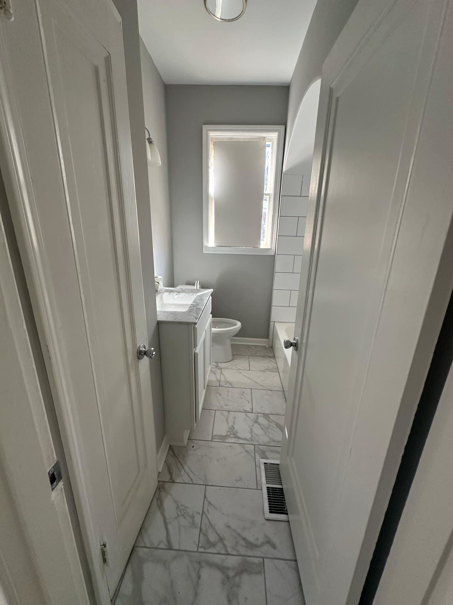 Full bathroom with vanity, toilet, and shower / bathtub combination