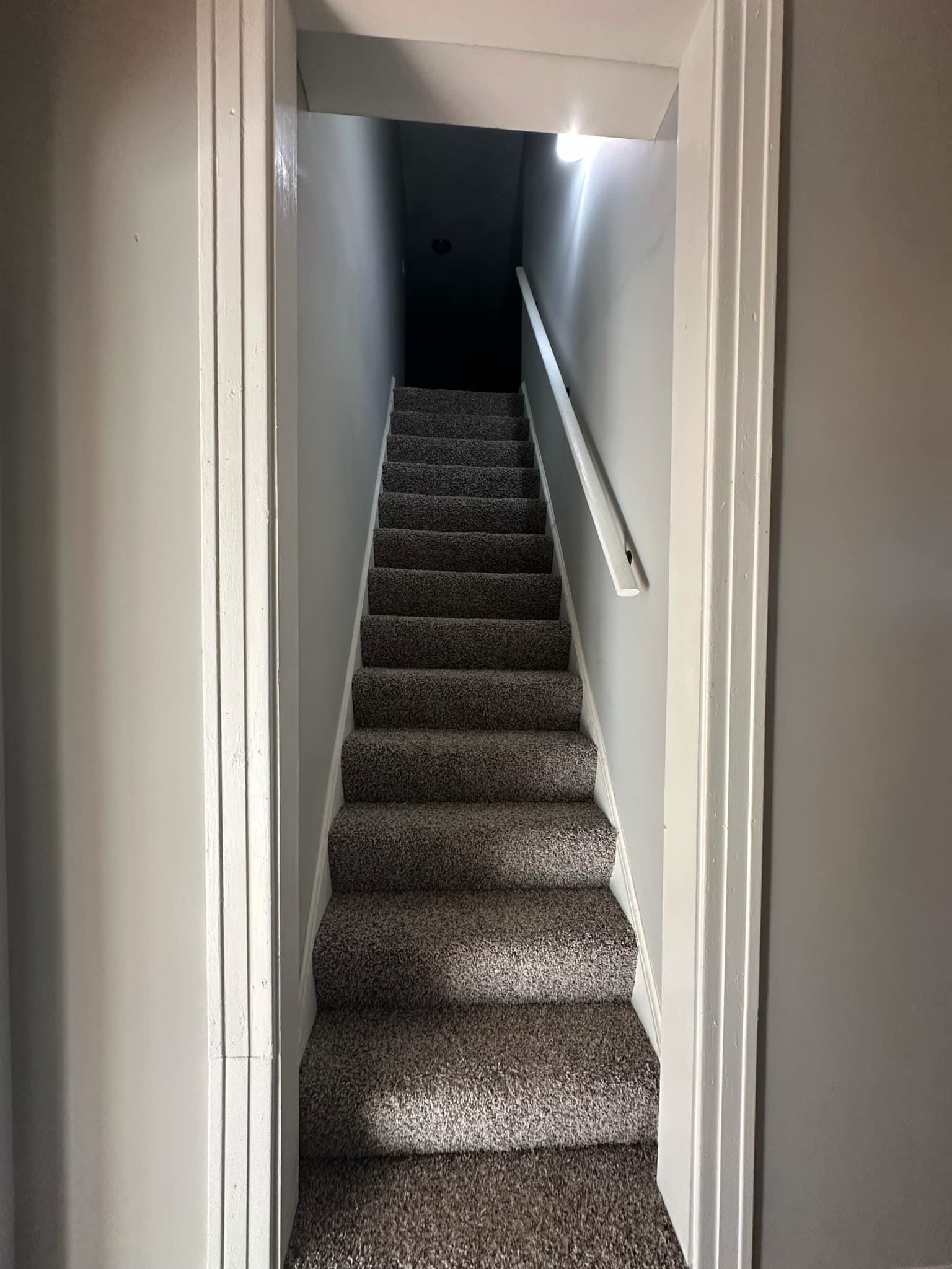 Stairway featuring carpet