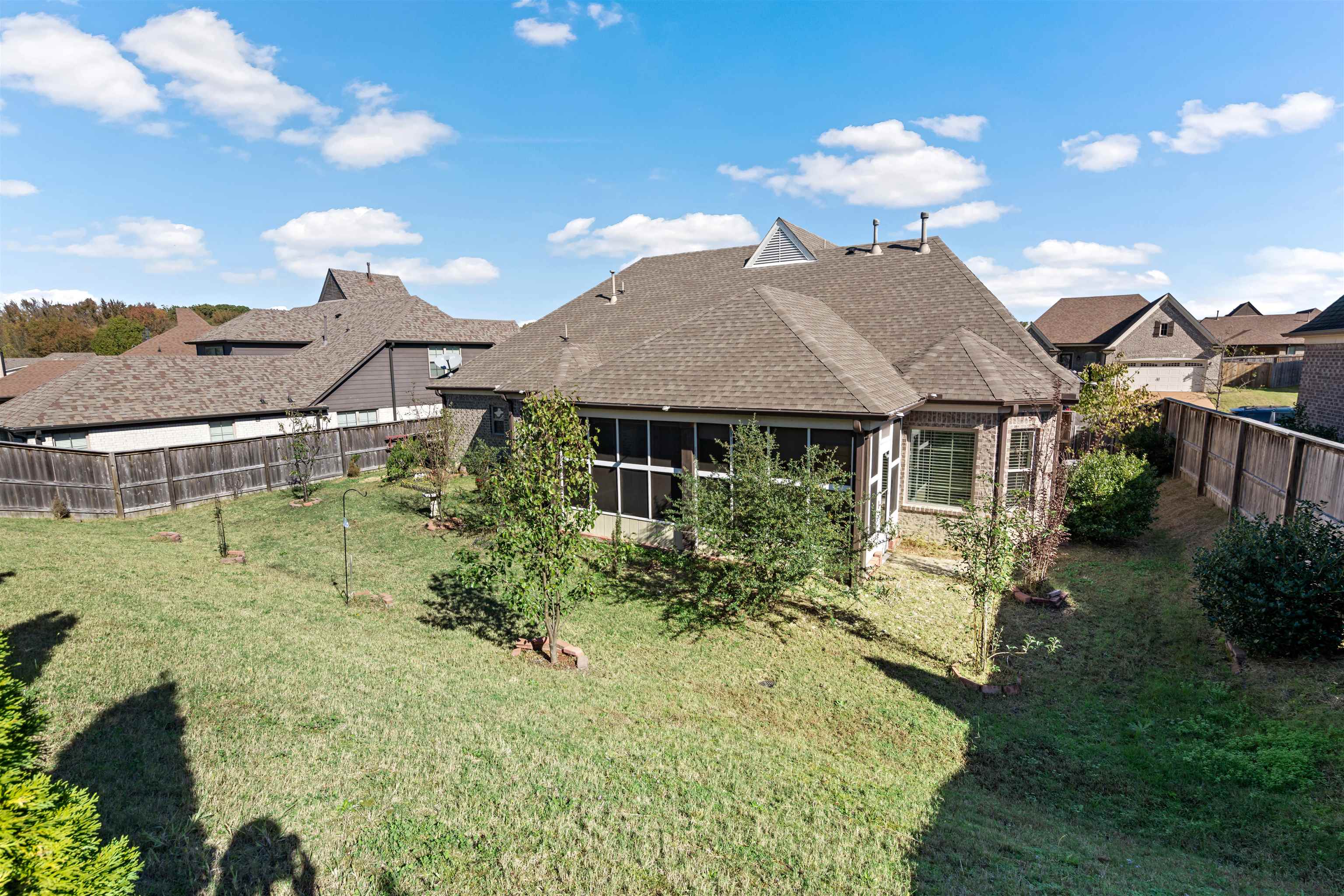 Rear view of property featuring a lawn