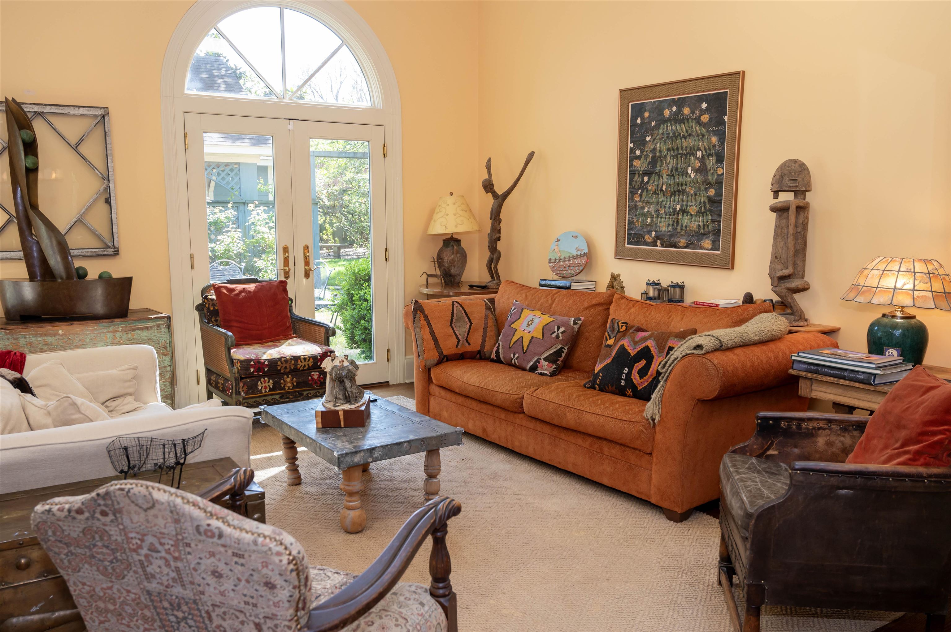 Anther shot of the sunroom. The French doors look onto a yard straight out of Veranda!