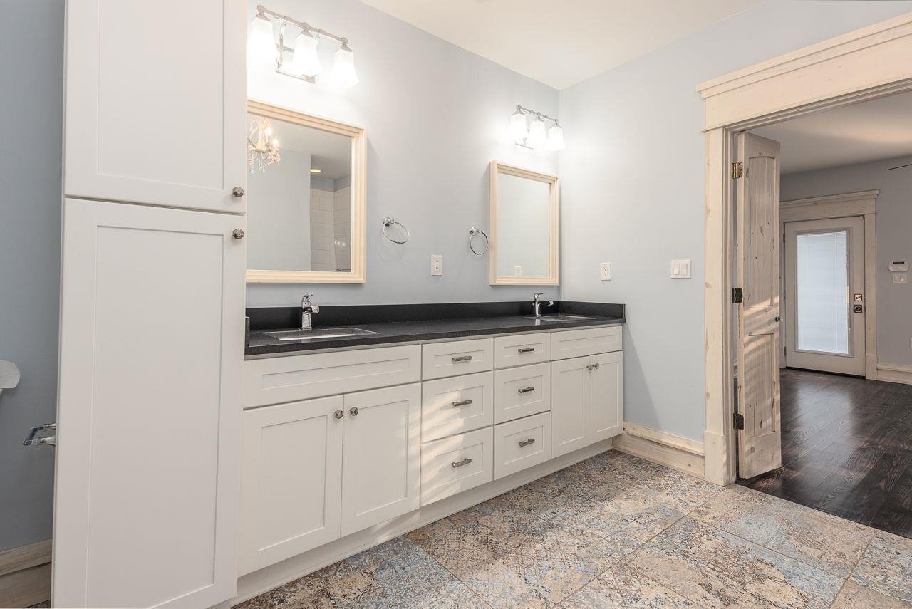 Bathroom with hardwood / wood-style flooring and vanity