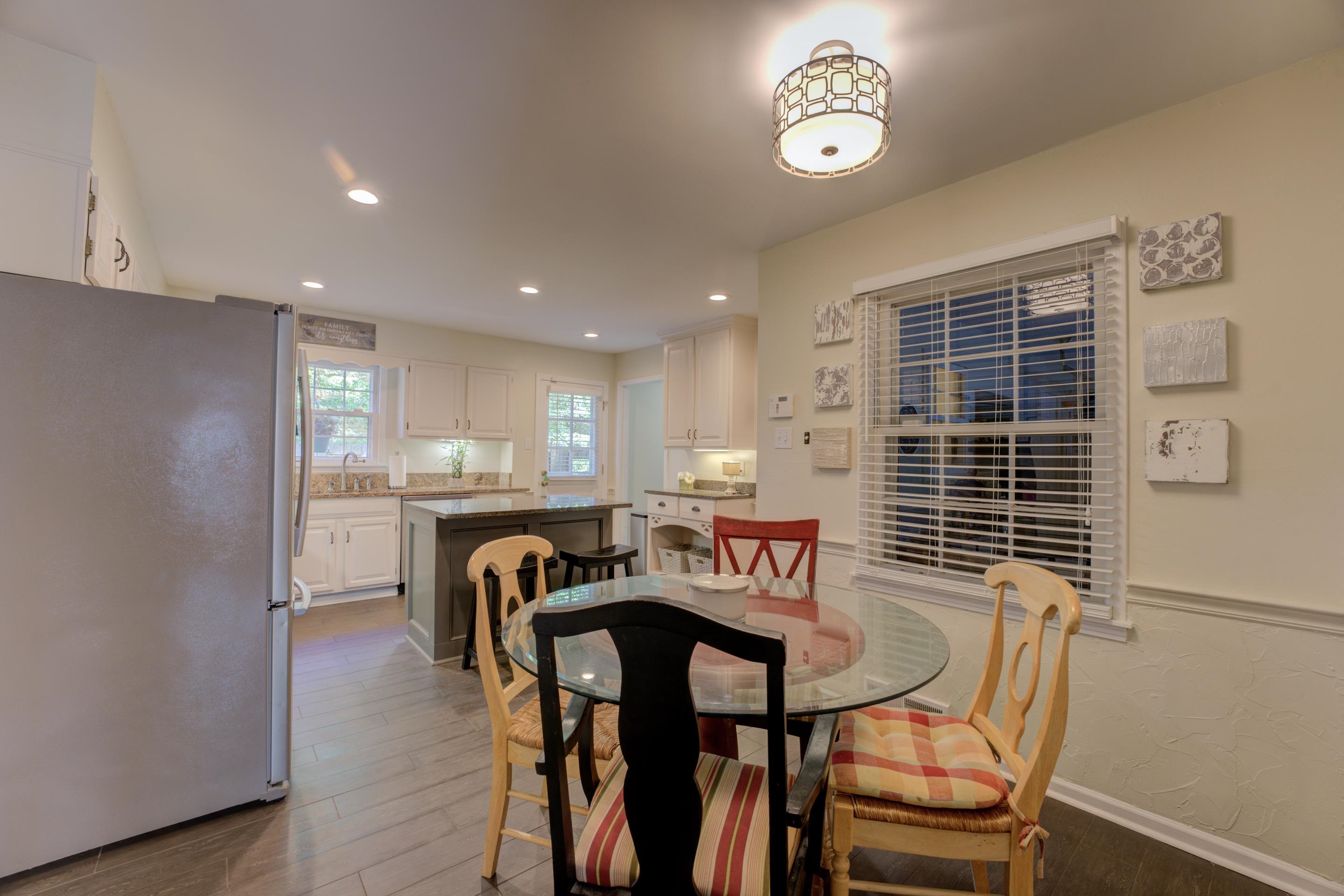 Enjoy meals in a delightful eat-in kitchen featuring a charming breakfast area, perfect for casual dining and morning coffee.