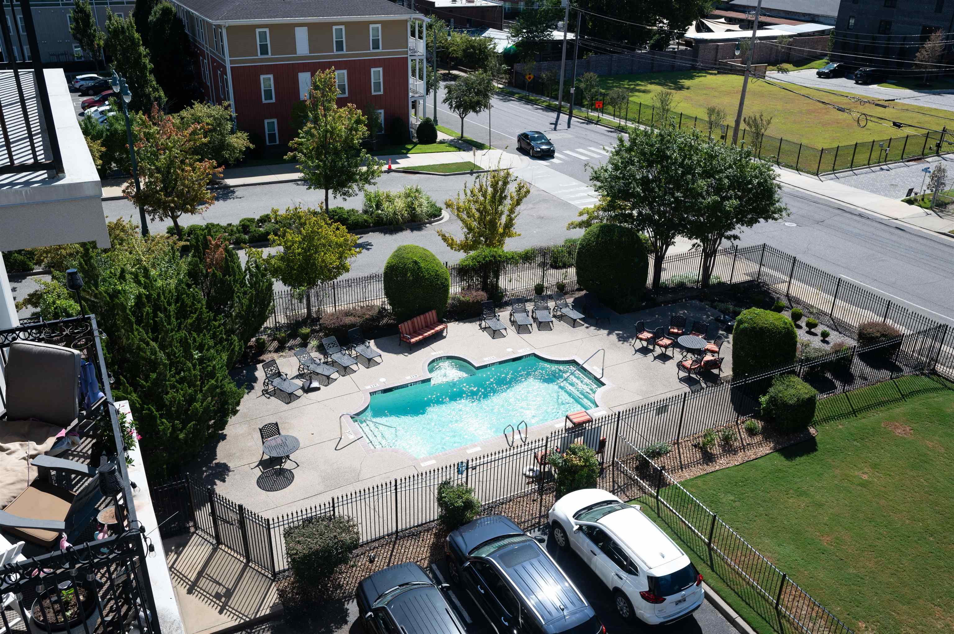 View of pool featuring a yard and a patio