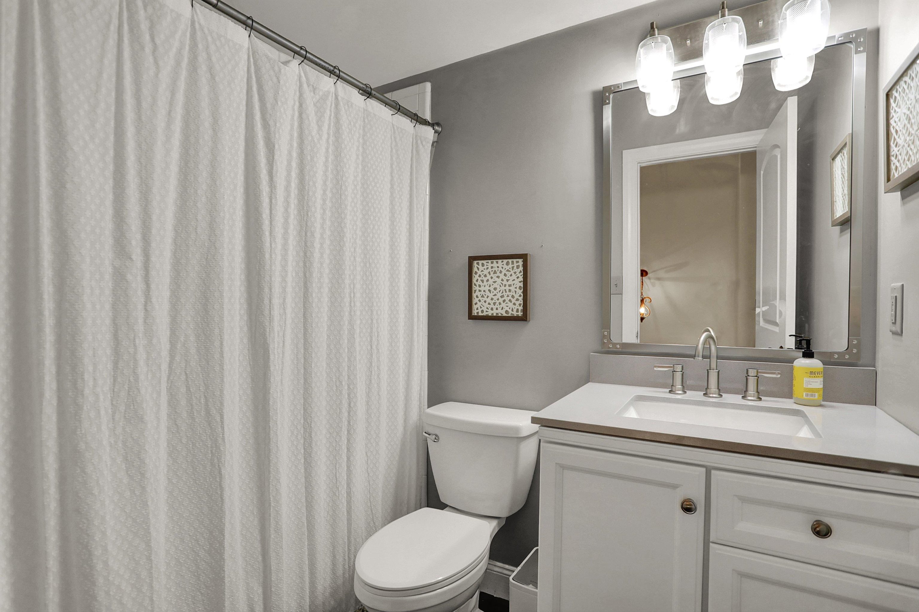 Separates Bedroom 2 and Bedroom 3 in upstairs hall. Tub with tile shower
