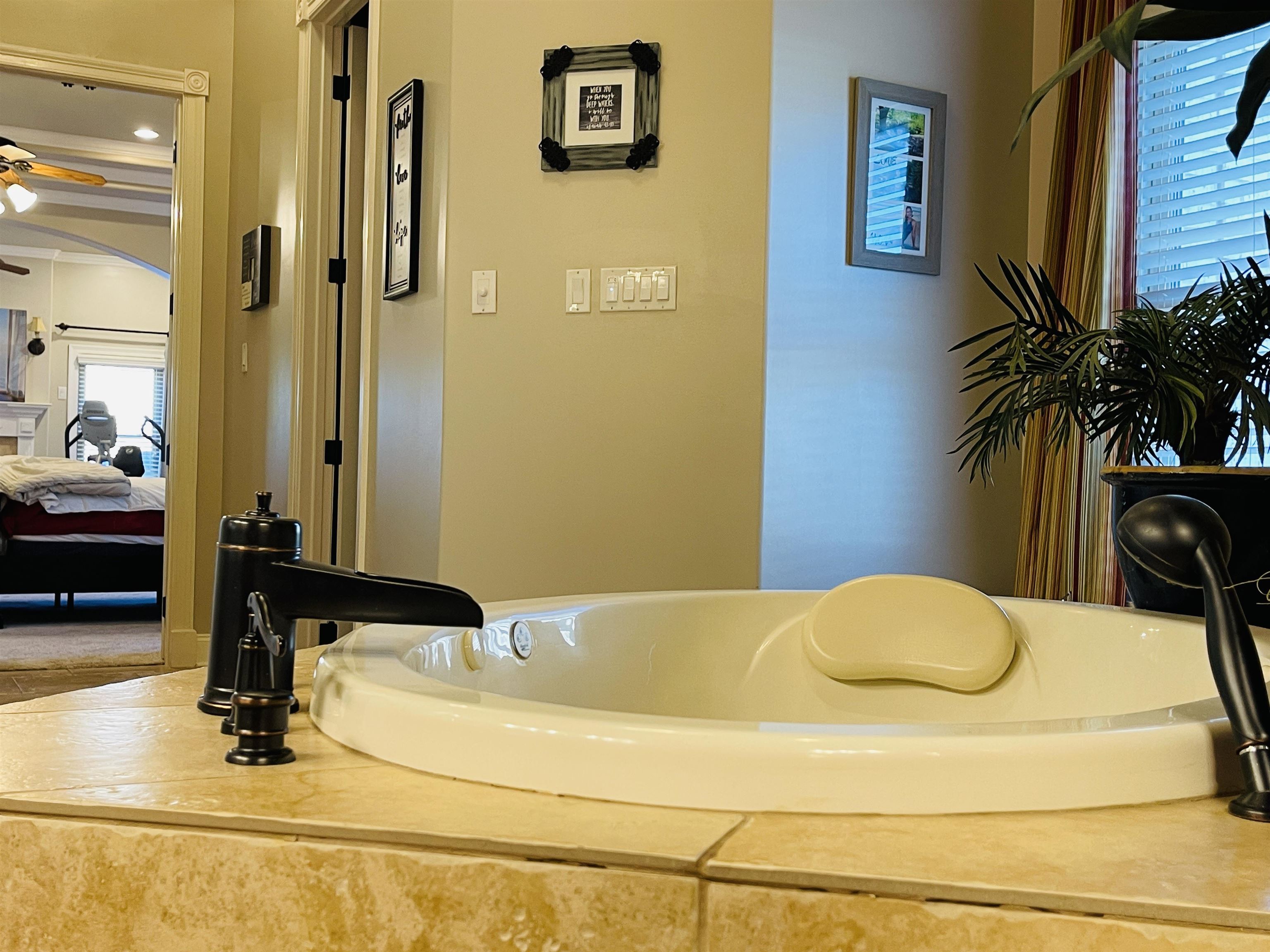 Bathroom featuring ceiling fan