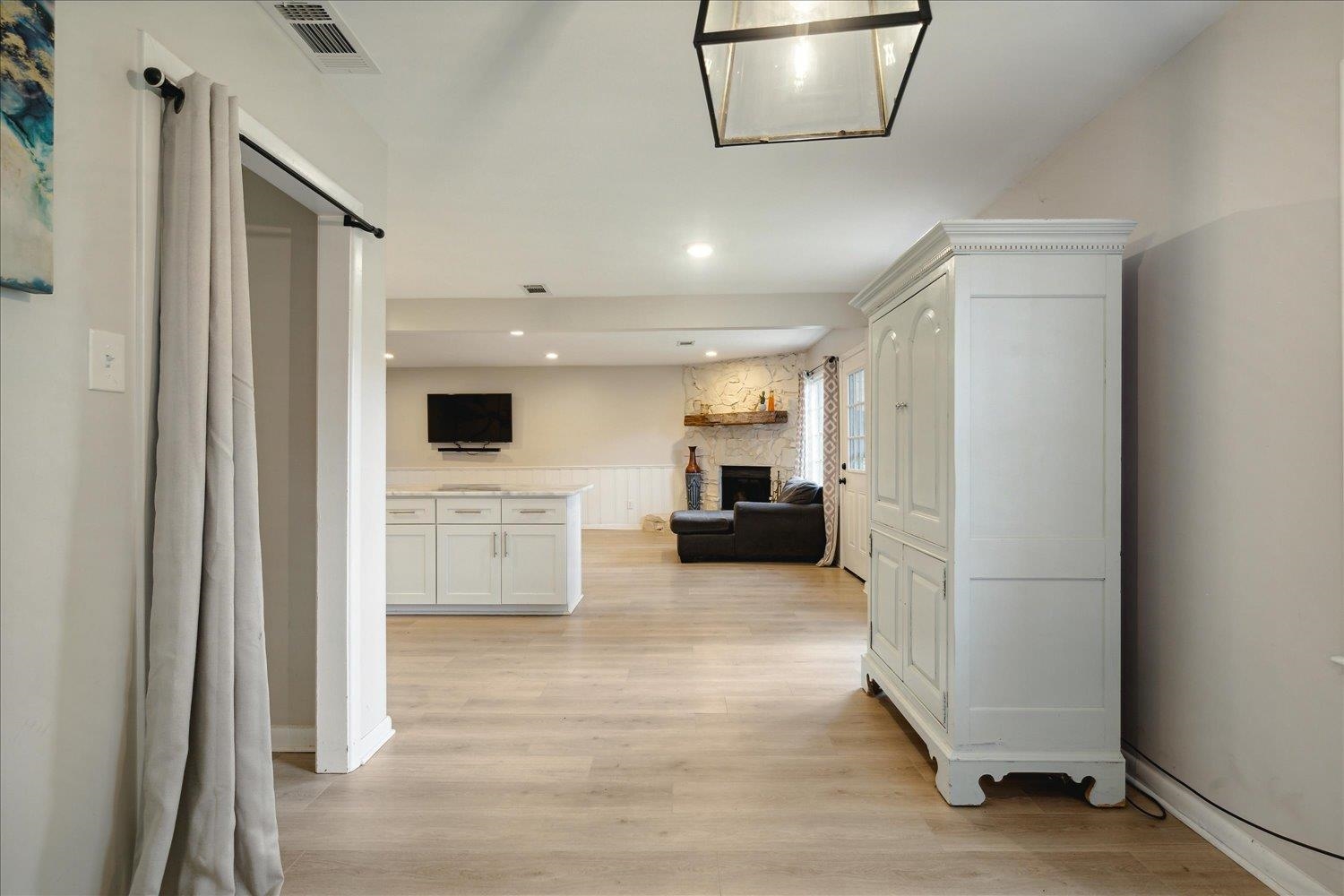 Hall featuring light wood-type flooring