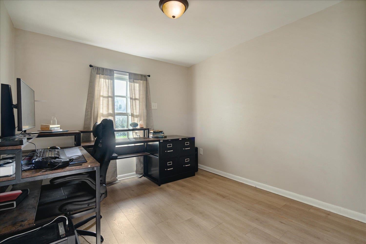 Office area featuring light hardwood / wood-style floors