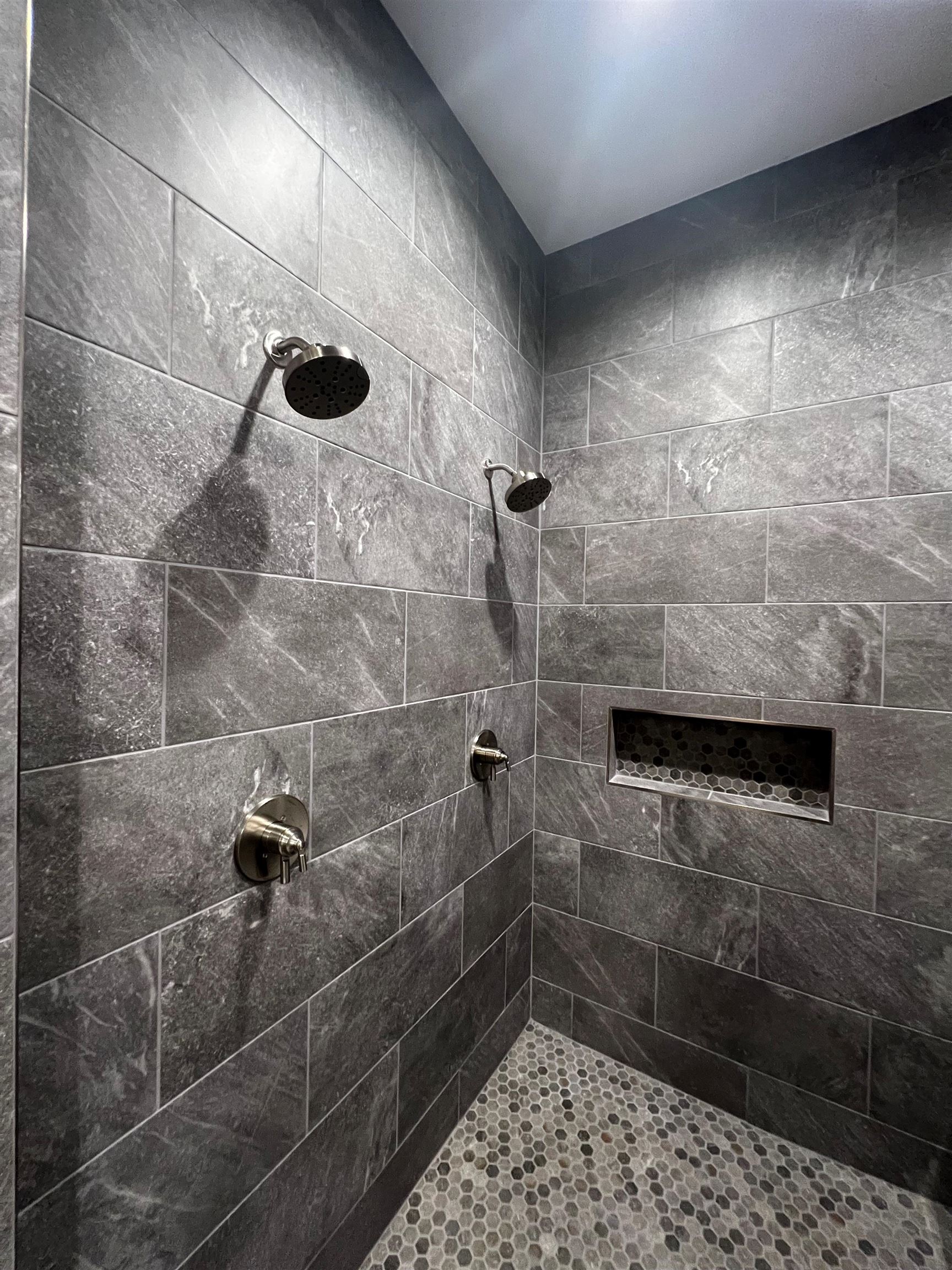 Bathroom featuring tiled shower